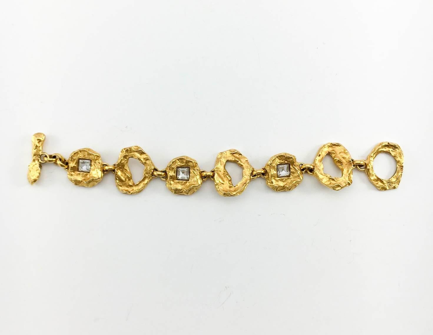 Striking Vintage Lacroix by Goossens Bracelet. This gorgeous Lacroix bracelet by Robert Goossens is gold plated and features Gripoix crystals. The design showcases the mastery of Maison Goossens in making jewellery and giving it an organic look and