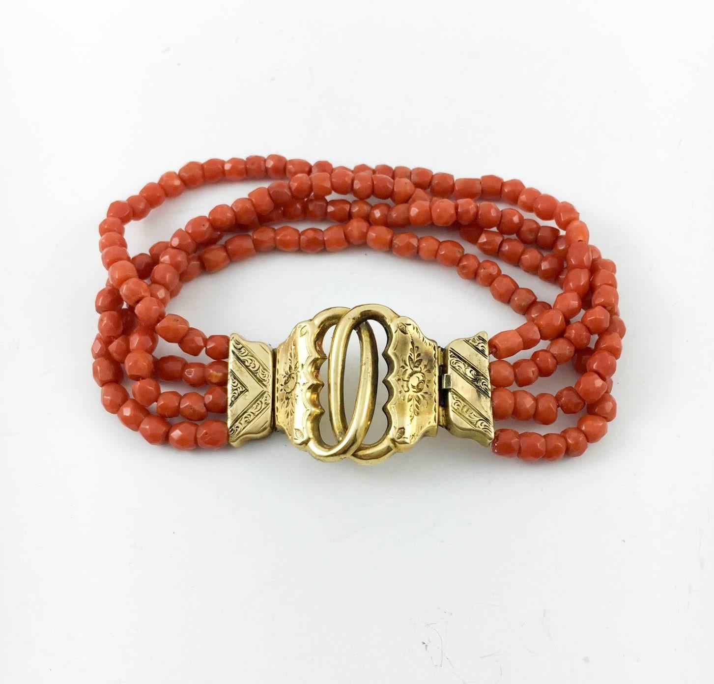 Stylish Antique Coral and Gold Bracelet. This very elegant bracelet dates back from about 1820s – 1840s. It features 4 strands of facetted coral beads and an 18ct gold clasp, with a lovely pattern on it. Hallmarked. This is a beautiful and