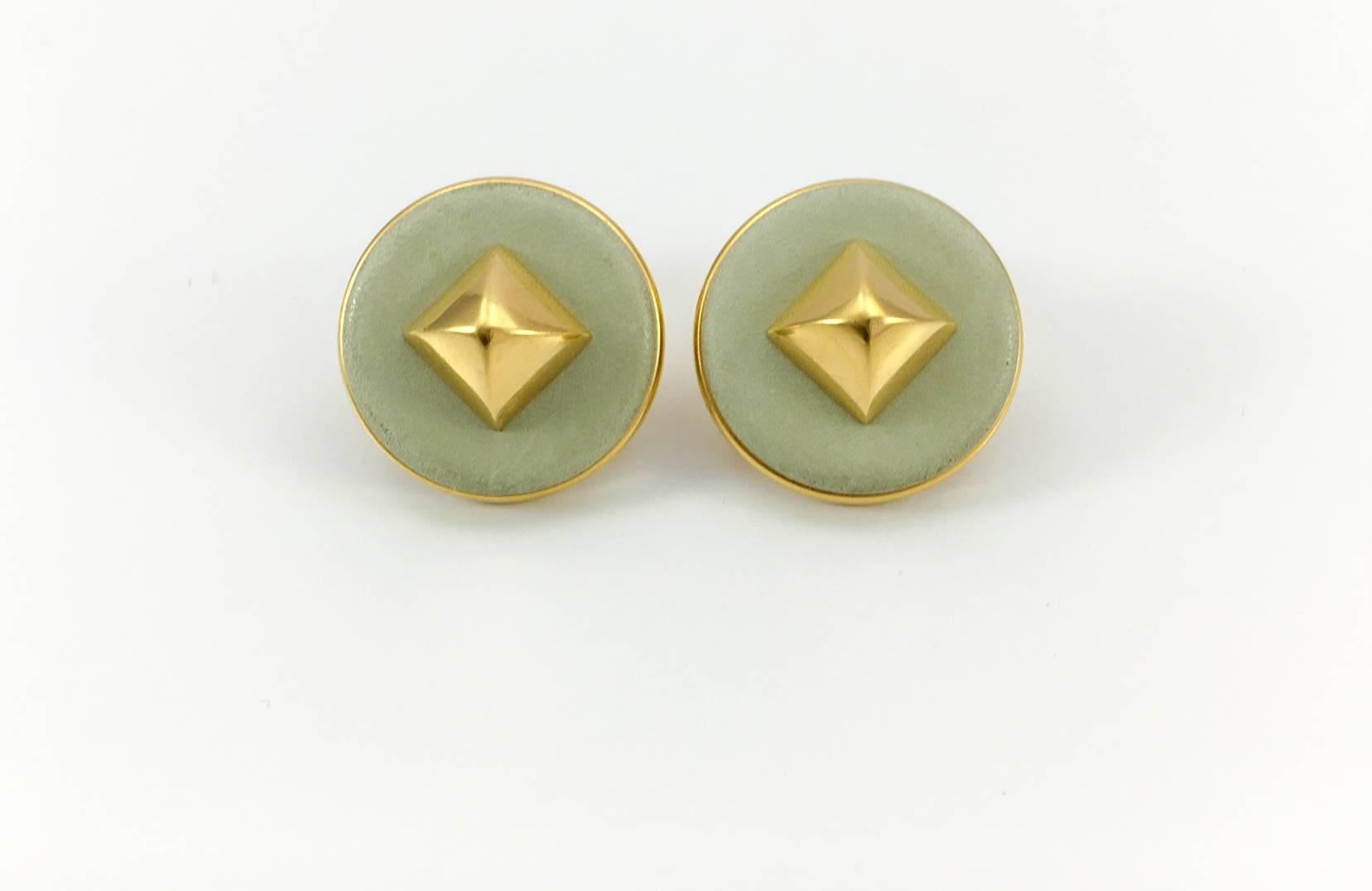 Stylish Hermes Medor Leather and Gilt Metal Earrings. These very elegant earrings by Hermes are made in pale green medor leather. They feature a gilt metal pyramid shaped stud in the centre. Hermes signed on the back. A perfect example of the