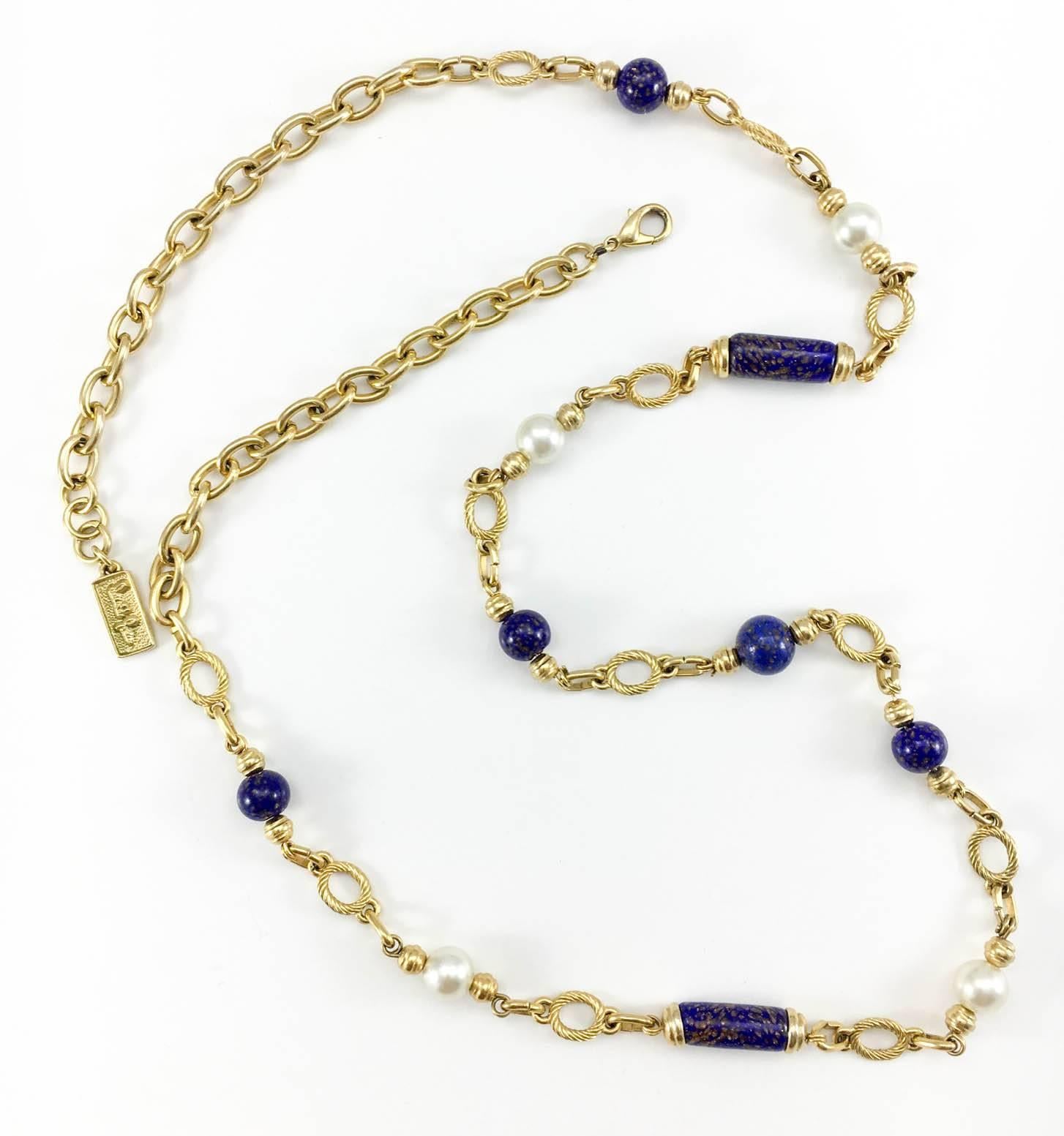Vintage David Grau Beaded Necklace. Very stylish long chain with beads by Spanish designer David Grau. Blue and golden glass beads and glass pearls are distributed along the gilt links. Signed.

Label / Designer: David Grau
Period: 1990s
Origin: