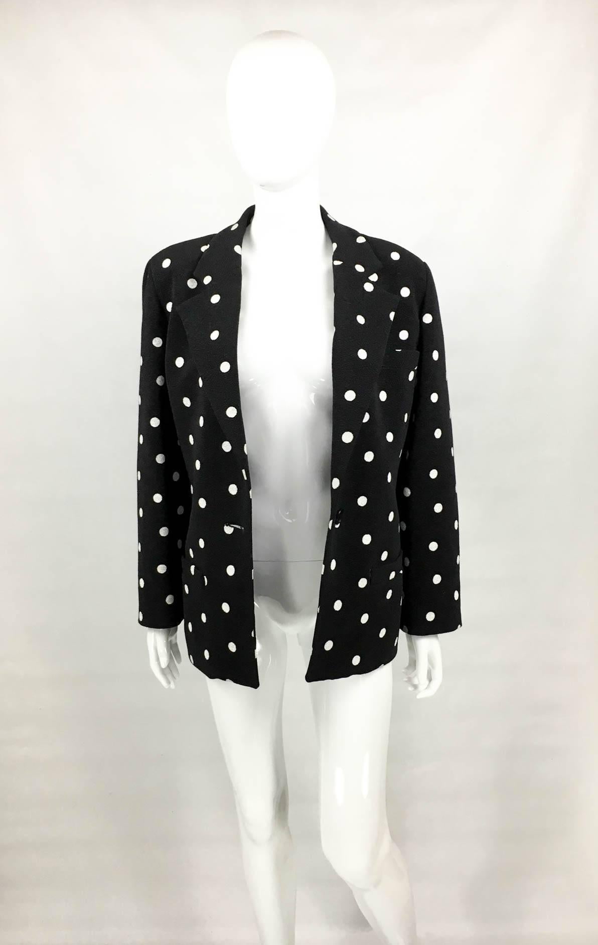 Vintage Balenciaga Black and White Polk Dot Blazer. This striking 1980s black blazer by Balenciaga features white polka dot. Fully lined, it has a one-button closure and three pockets. The fabric is textured and very tactile. Constructed with side