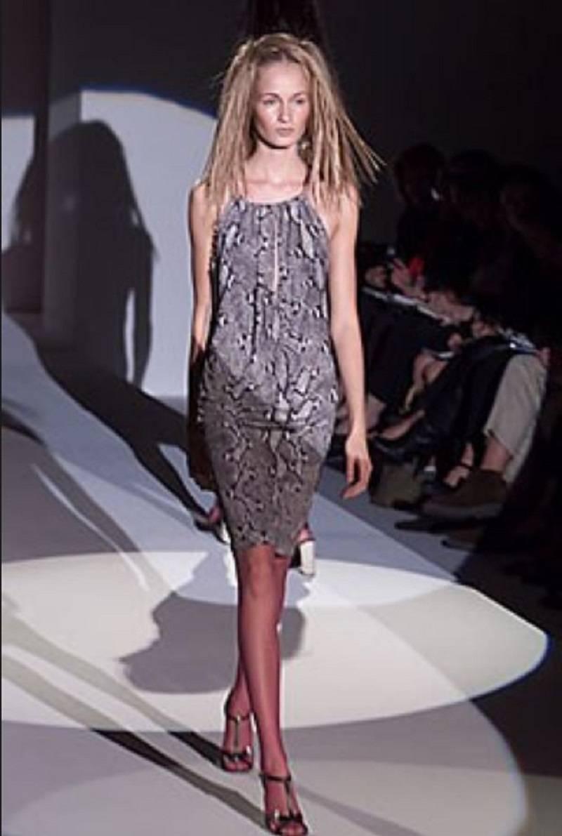 Gucci by Tom Ford Iconic Python Print Runway Dress. This gorgeous dress by Gucci was designed by Tom Ford and showed on the SS 2000 fashion show. The python print in shades of grey is Gucci signed. Self-lined. The dress features a delicate leather