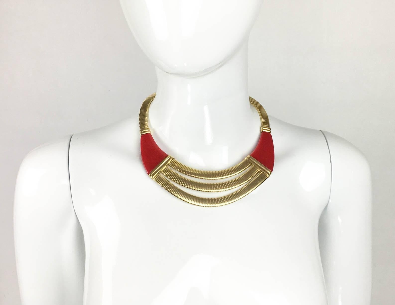 Stylish Vintage Givenchy Necklace. This striking piece by Givenchy is made in gilt metal and red resin. Dating back from the 1970s, the design is Art Deco inspired. Signed ‘Givenchy Paris – New York’ on the back of the clasp. This is a great piece