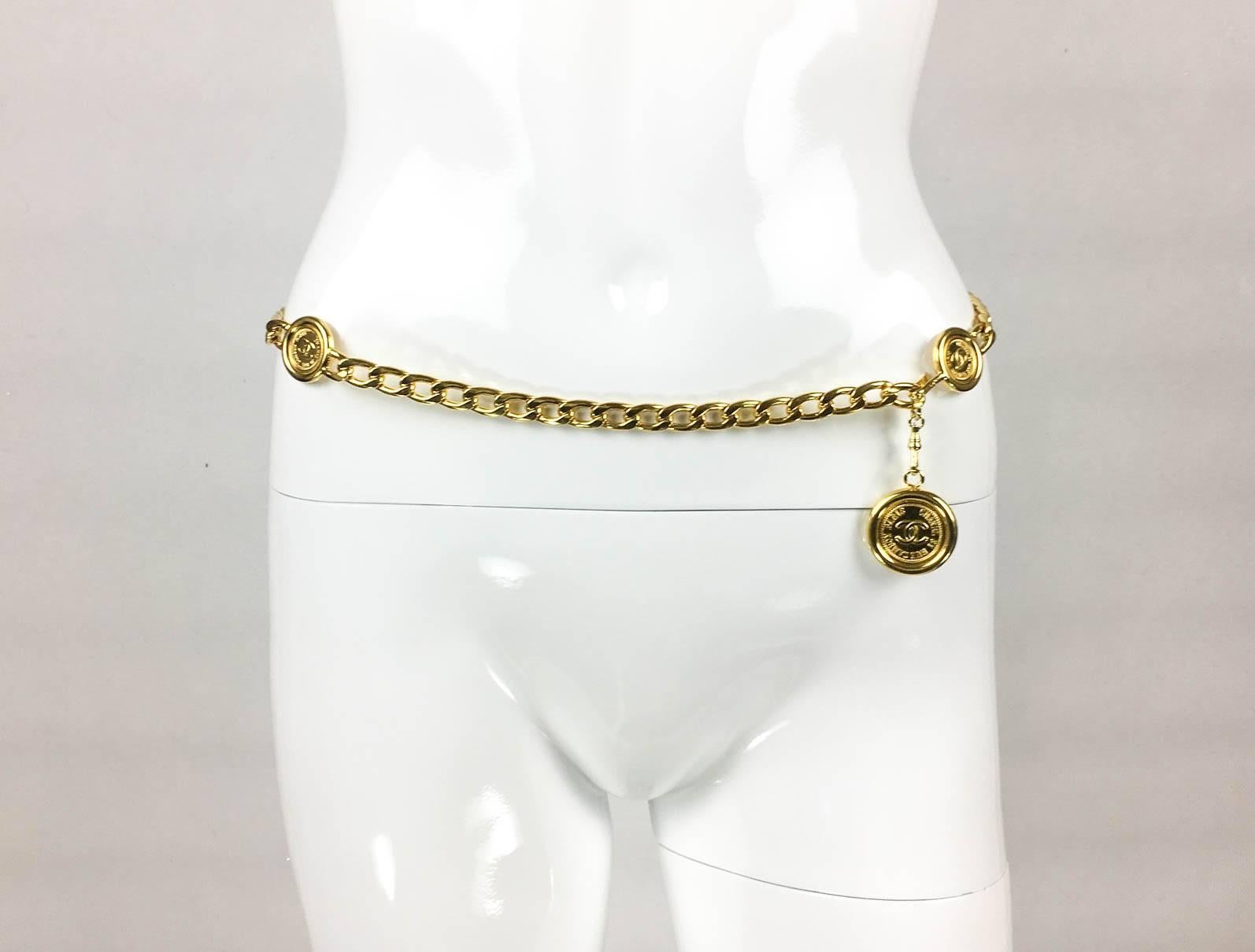 Striking Vintage Chanel Gold-Tone Chain Medallion Pendant Belt/Necklace. This gorgeous piece by Chanel was created in the mid-1990s. It consists of the iconic ’31 Rue Cambon and ‘CC’ Logo’ medallions distributed along the chain and a larger hanging