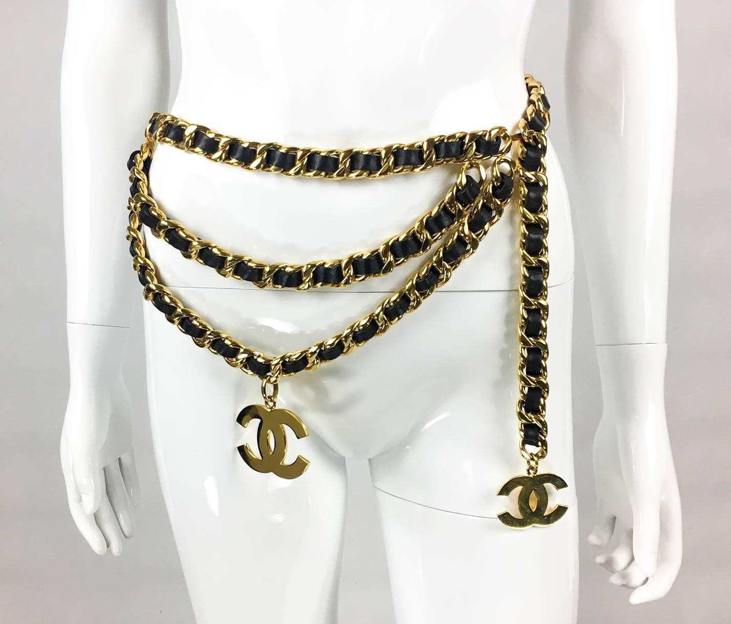 Chanel Vintage Runway Belt. This fabulous belt by Chanel made in gold-tone hardware and black leather dates back from 1992. The chunky chain is interwoven with black leather and features 2 iconic ‘CC’ Chanel logos. One chain goes around the waist,