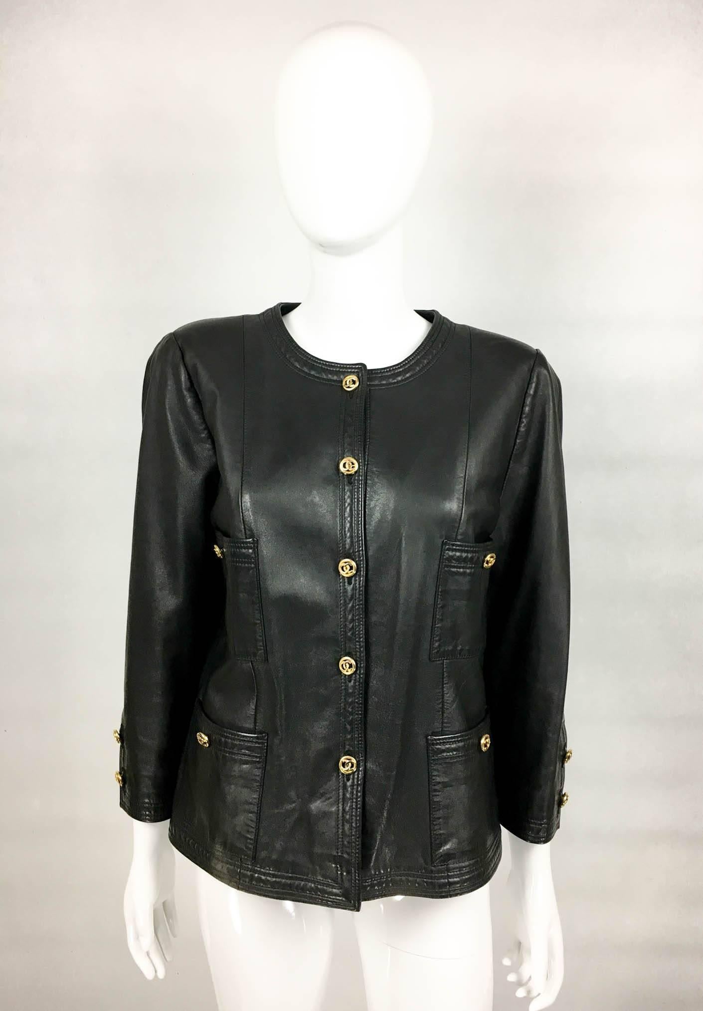 Stylish Chanel Vintage Leather Jacket. This fabulous jacket by Chanel from the 1980s is made in soft black leather. It features gilt buttons in the shape of the iconic ‘CC’ logo. There are 4 front pockets, each with a button. Collarless and boxy, it