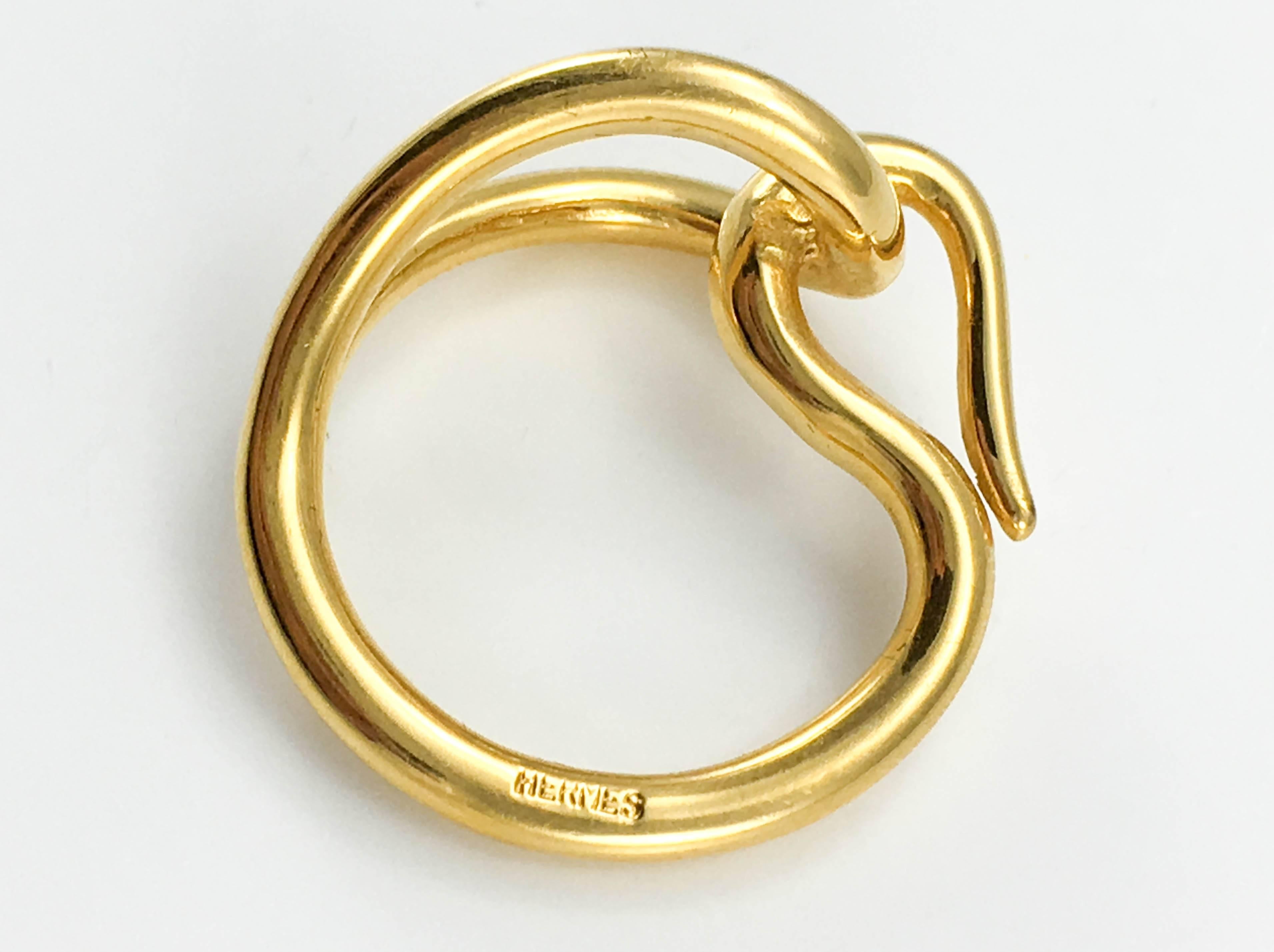 Really stylish Hermes Scarf Ring. This is a beautiful design by Hermes, with very clean and elegant lines. This is one of those small details that will elevate any look. Hermes signed.

Designer/Label: Hermes

Period: 21st Century

Origin: