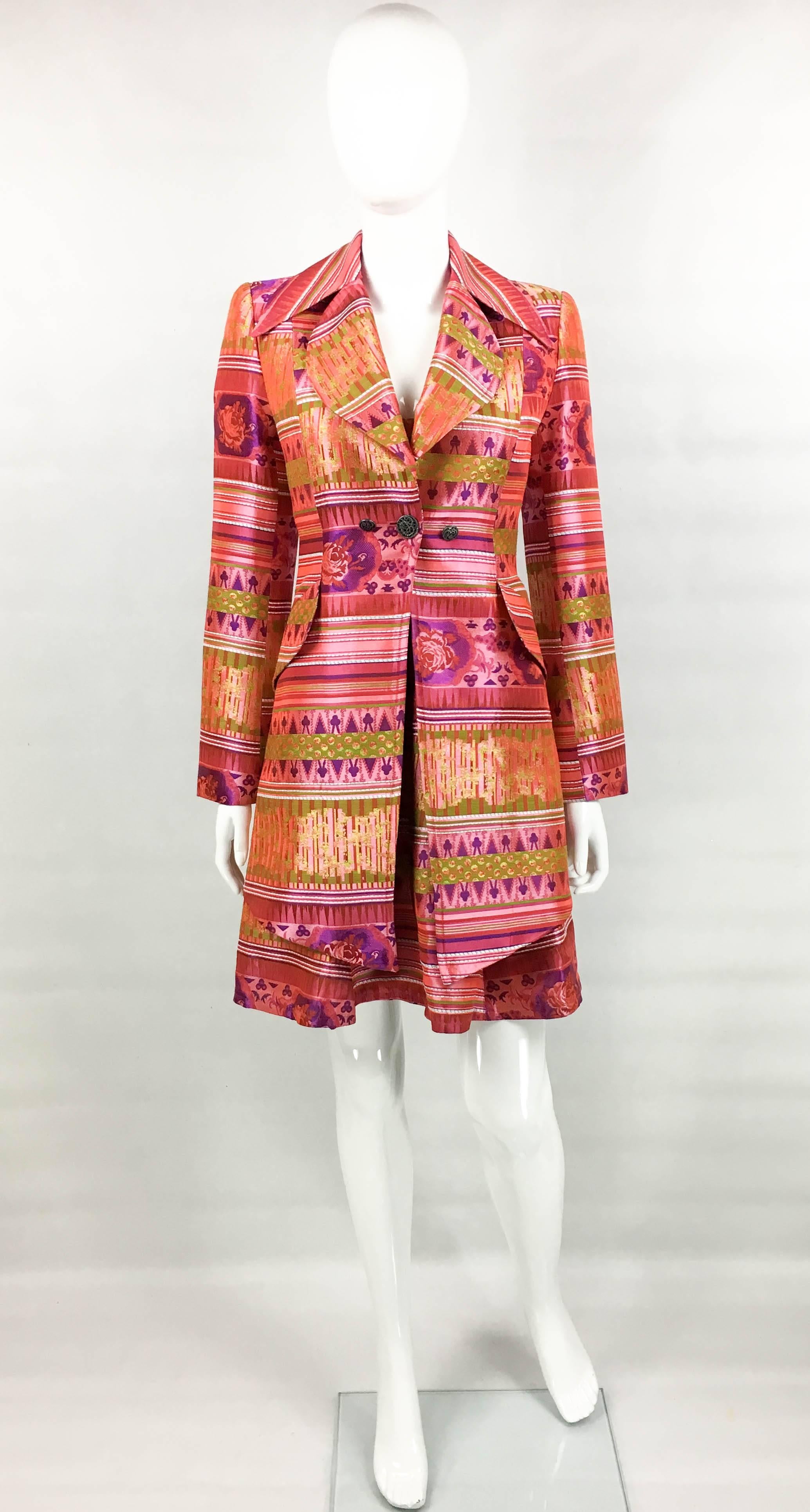 Fabulous Vintage Christian Lacroix Dress and Jacket Ensemble. These stunning 1990s piece by Lacroix are a show-stopper. Comprising of a bustier dress and a long jacket, this ensemble is made in a bold patterned brocade predominantly in pink. The