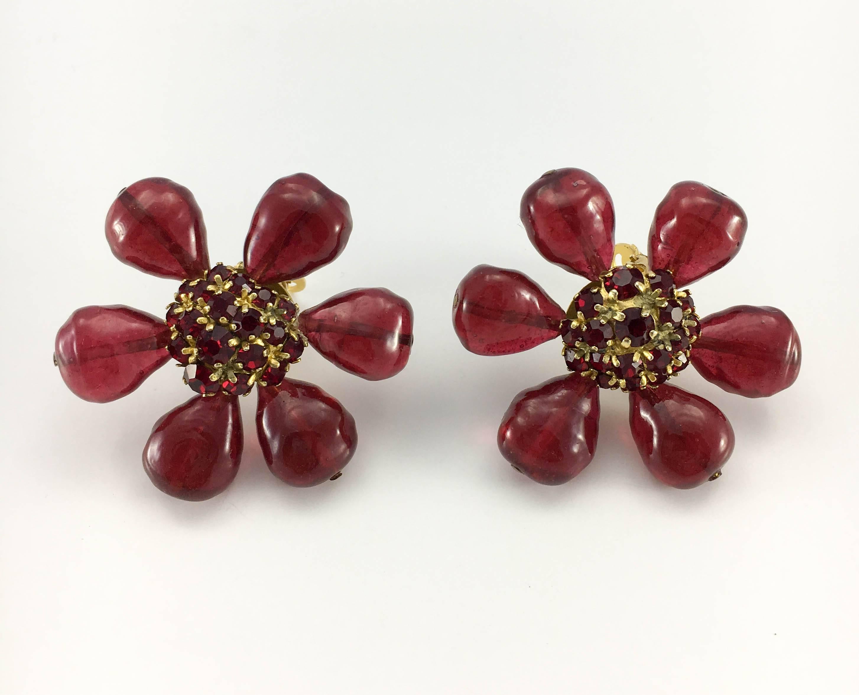 Stunning Vintage Chanel Red Gripoix Flower Clip-On Earrings. These amazing earrings by Chanel date back from the 1970’s. They are shaped as large stylised flowers. The petals are made in deep, burnt red gripoix (poured glass), whereas the centre