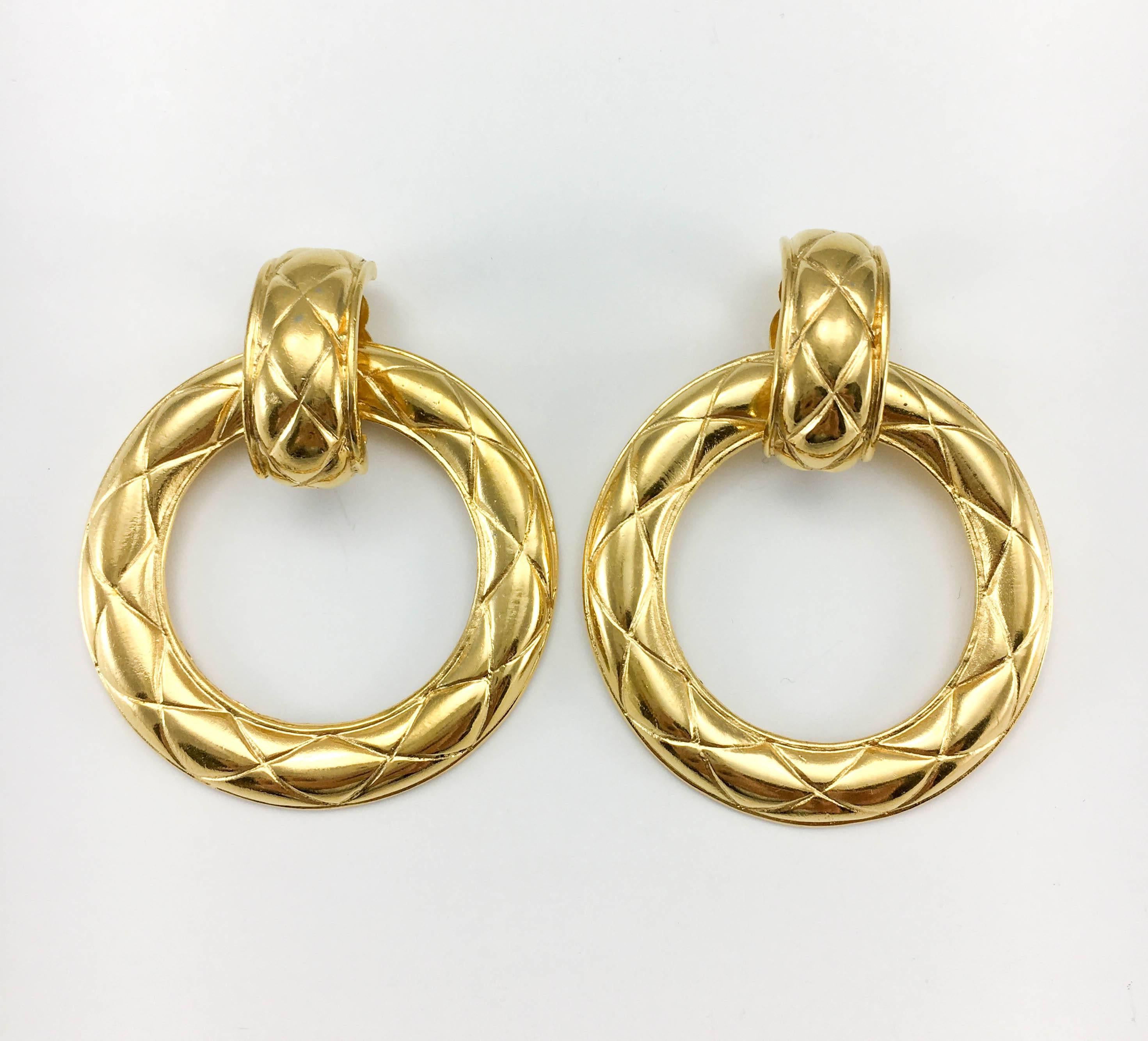 Gorgeous Vintage Chanel Large Hoop Earrings. These amazing earrings by Chanel date back from the 1980’s. Gold-plated, their design emulates the quilting that has been ever so present in the collections throughout the decades. Versatile, they can be