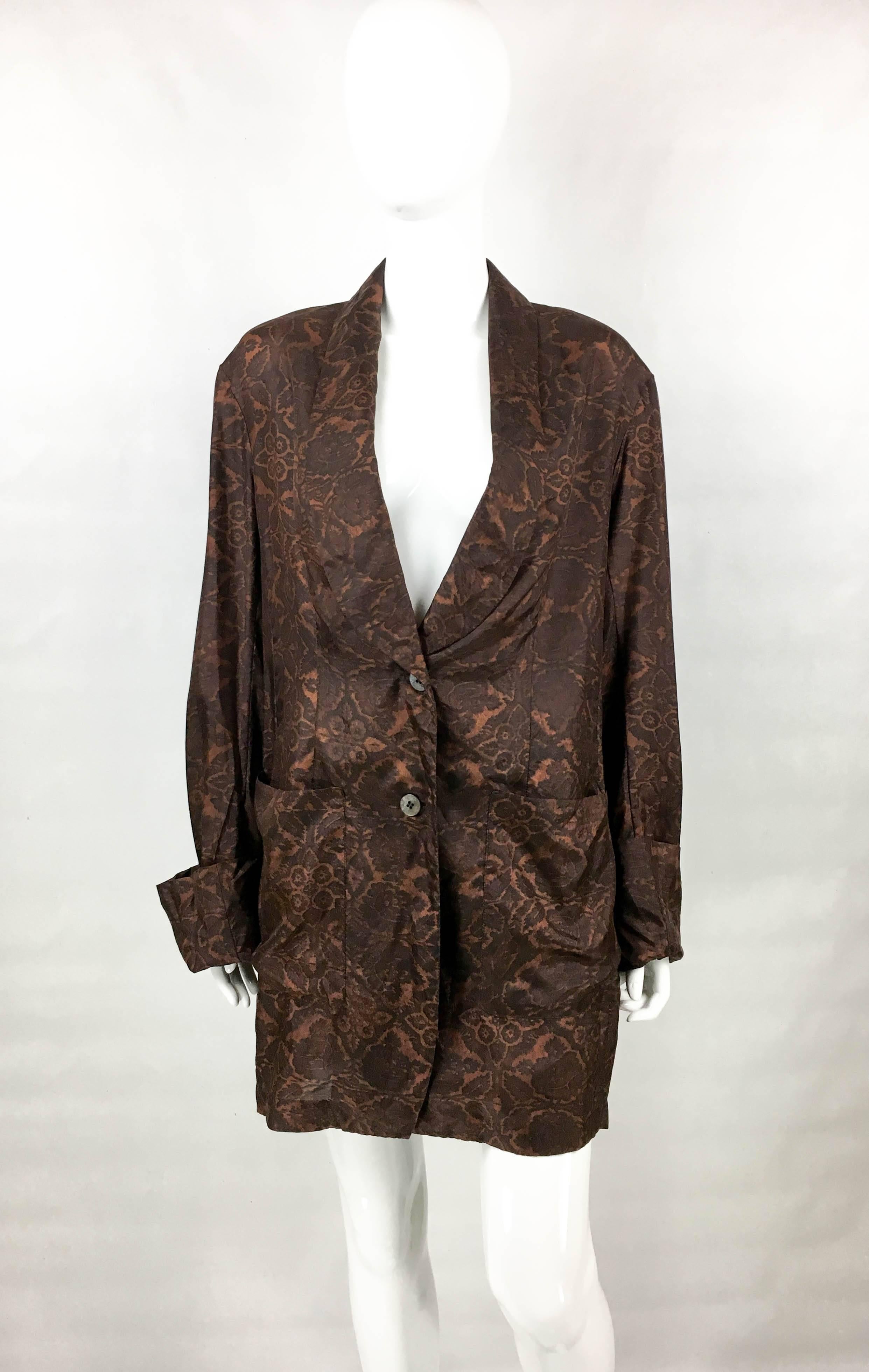 Stylish Vintage Dries Van Noten Deconstructed Silk Shirt / Jacket. Made in pure silk, this 1990’s pyjama style jacket features a floral pattern in accents of brown. The design is oversized, with very long sleeves, single breasted with 2 buttons and