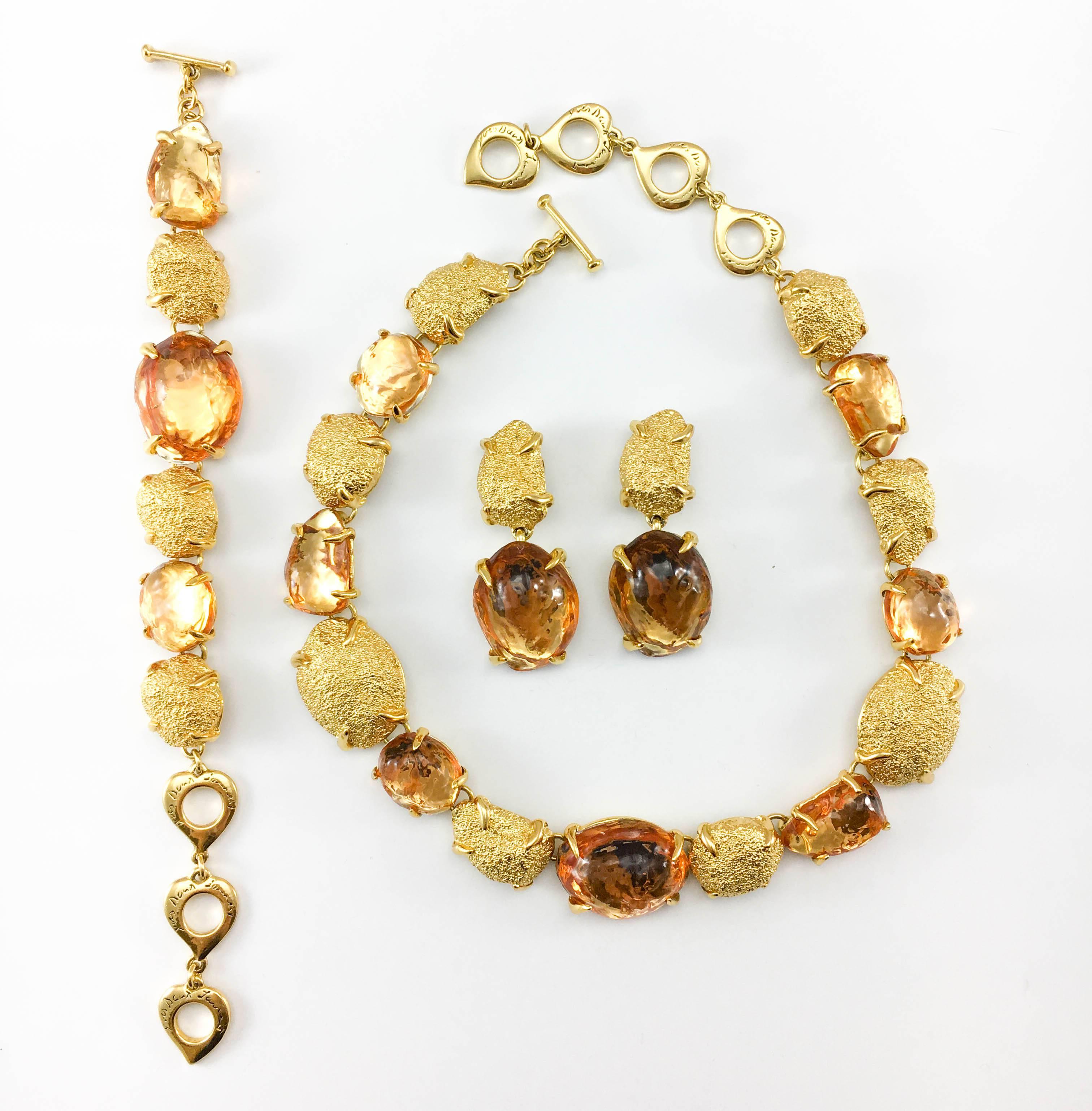 Vintage Yves Saint Laurent Necklace, Bracelet and Earrings Set. This fabulous set by Yves Saint Laurent was created by Robert Goossens in the 1980’s. As it was a trademark in Goossens’ work, the pieces have a very organic look and feel. The design