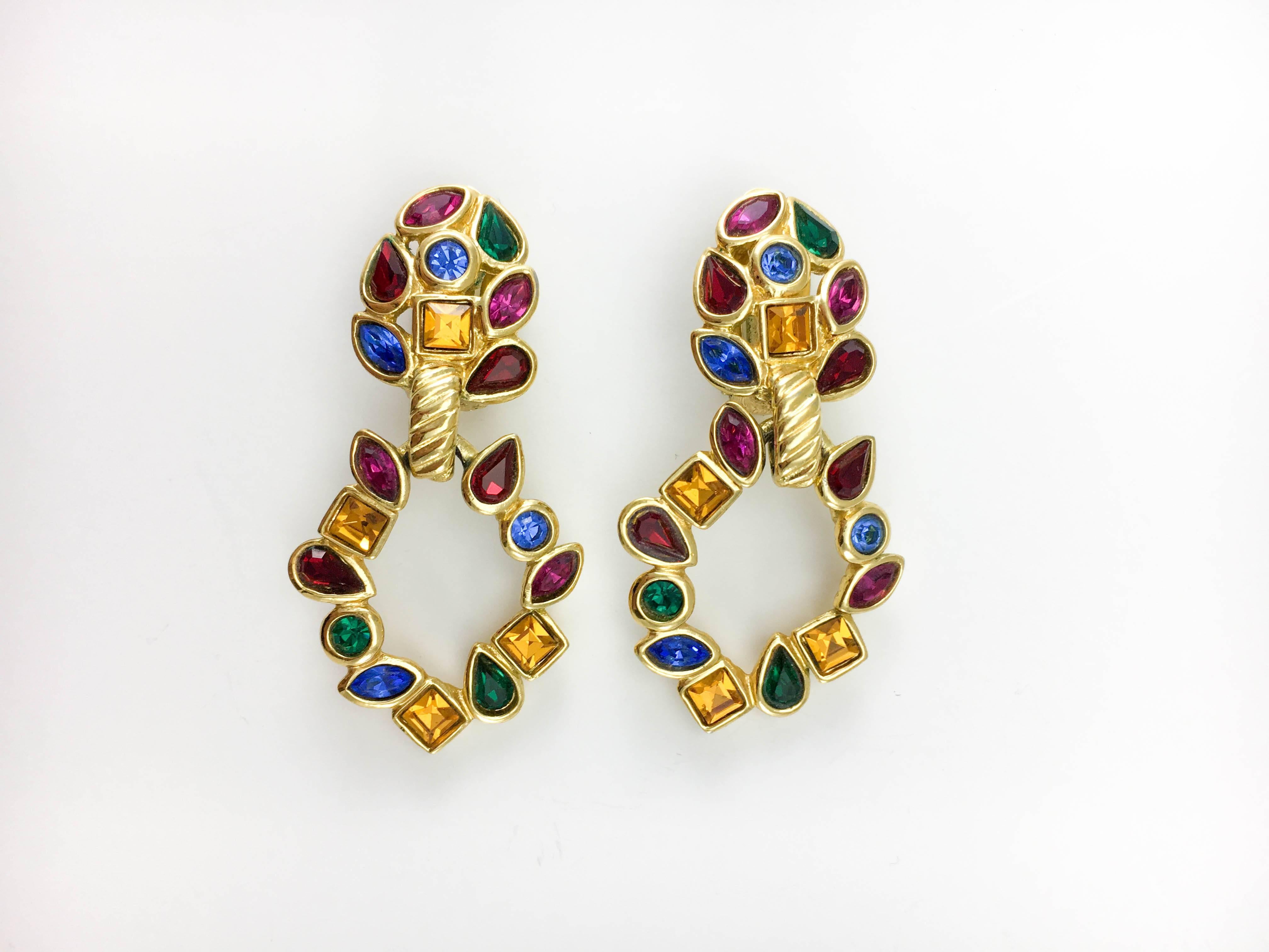 Vintage Yves Saint Laurent Multi-Coloured Glass Beads Dangling Earrings. These beautiful earrings by Yves Saint Laurent date back from the 1980’s. In gilt metal, they are embellished with blue, red, purple, amber and green crystals in different