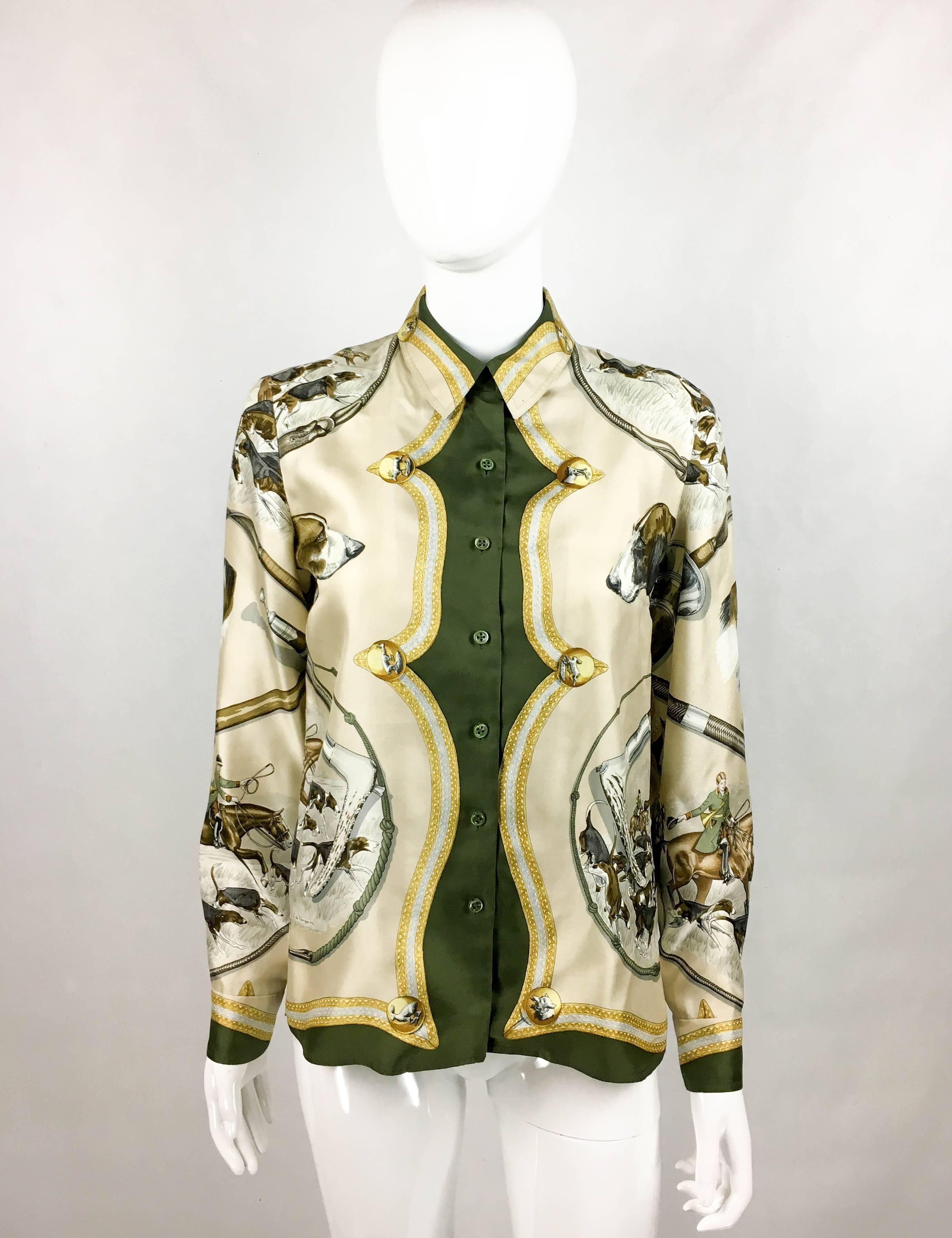 Vintage Hermes Printed Silk Shirt. This beautiful silk shirt by Hermes dates back from the 1970’s, more precisely from 1979. The hunting-themed print, designed by J. de Fangerolla, features hounds and hunters on horses, as well as medallions with
