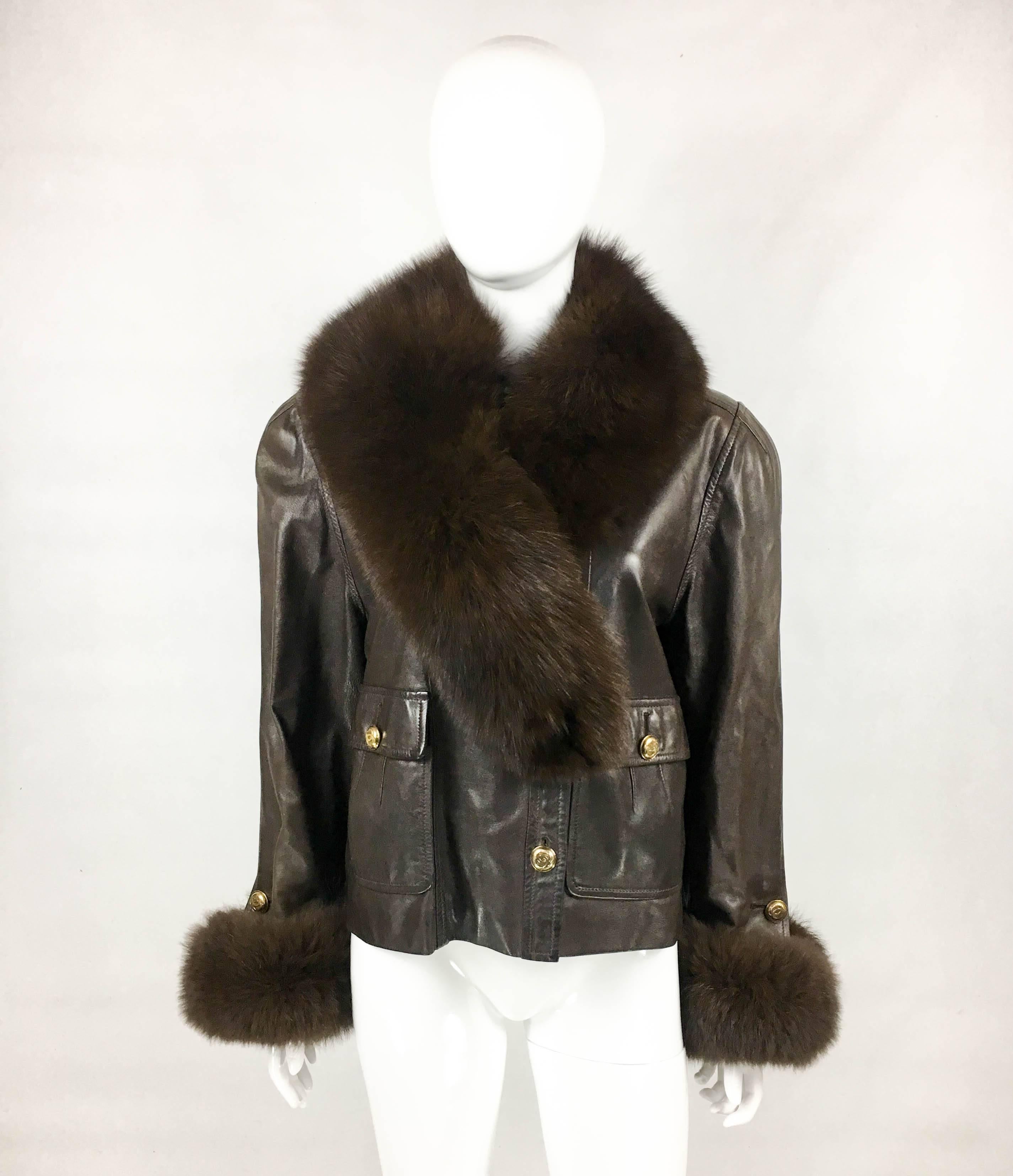 Vintage Chanel Leather Jacket with Fur Collar. This glamorous jacket by Chanel was created in the 1980’s. In soft chocolate brown leather, it features fox fur cuffs and removable collar (attachable to the third button down the front). The
