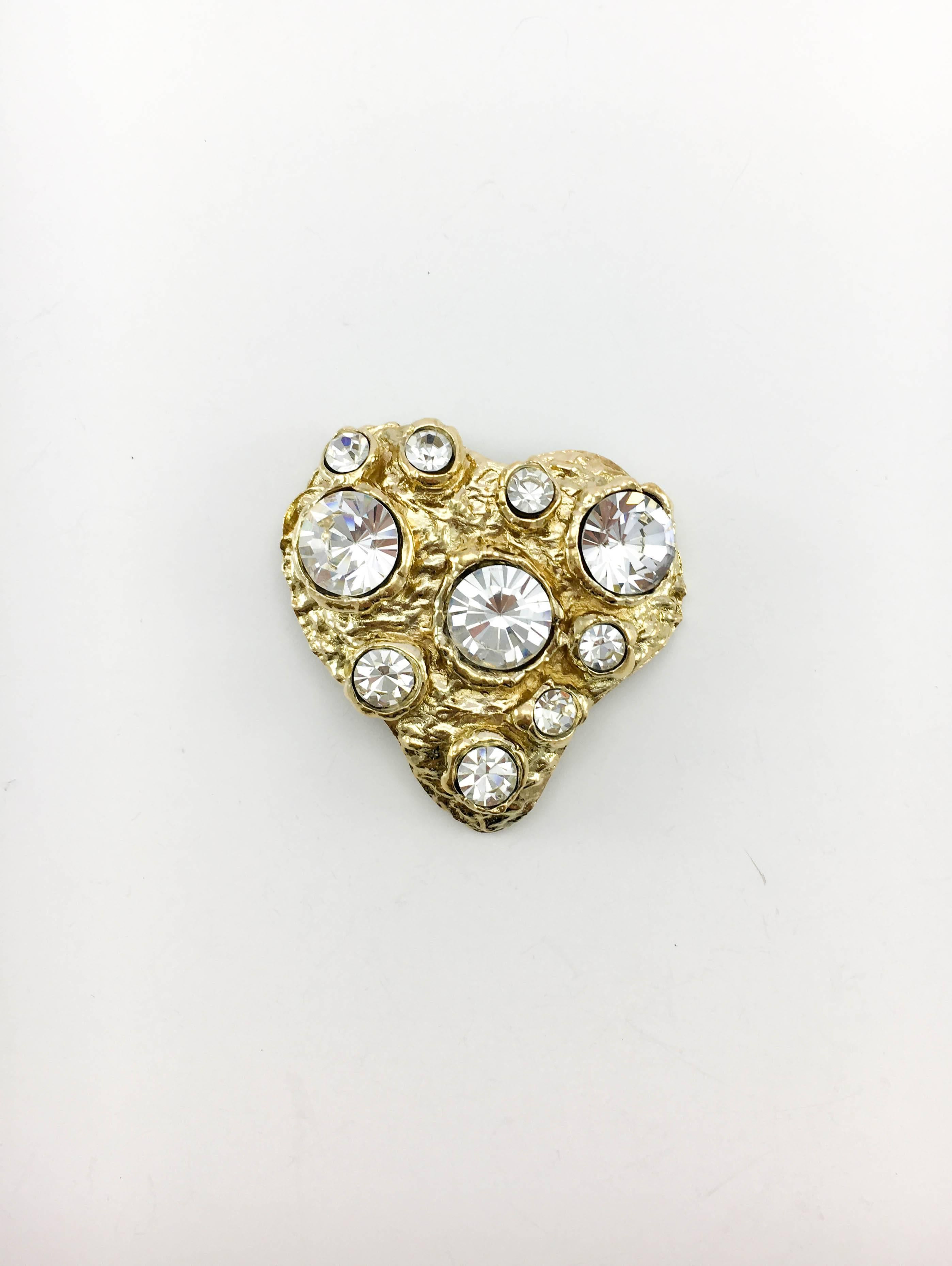 Vintage Christian Lacroix Crystal Gold-Plated Heart Brooch. This dramatic piece by Lacroix dates back from the 1980’s. In gold-plated metal, it is shaped as a large stylised heart encrusted with crystal beads in assorted sizes. Christian Lacroix