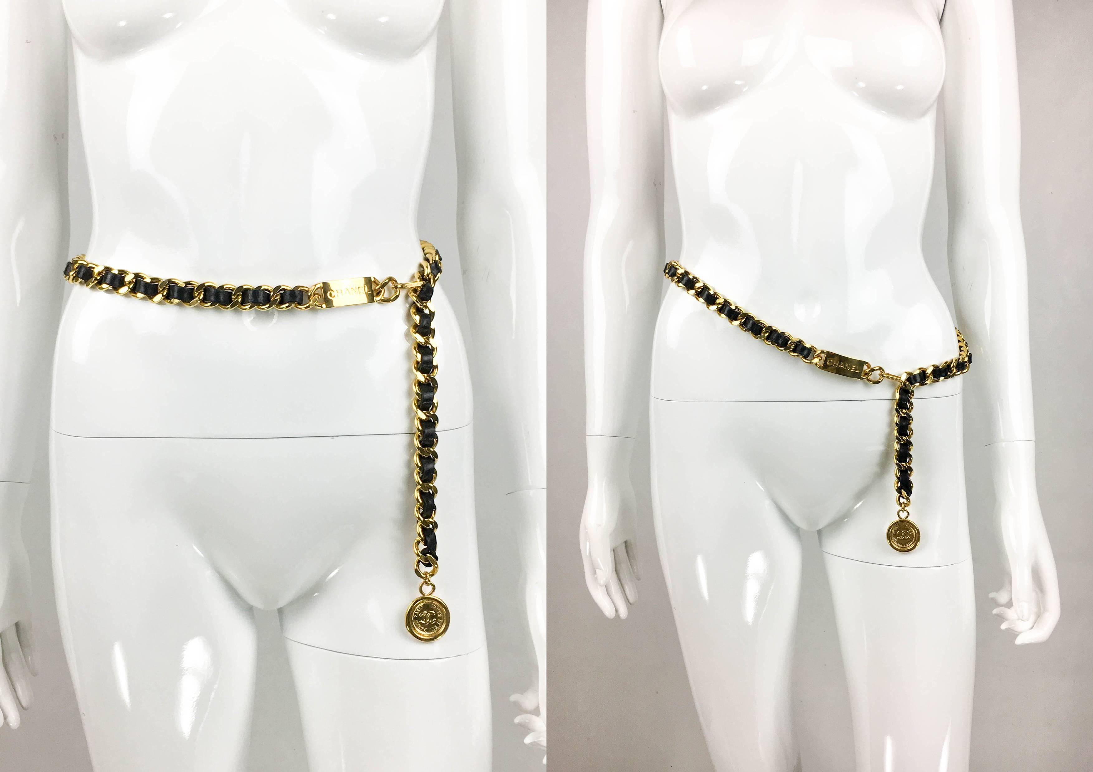 Vintage Chanel Gilt Chain and Leather Woven Belt / Necklace. This striking belt was crafted for the 1994 Spring / Summer Runway Show (please refer to photos). The chunky gilt chain is interwoven with black leather. On one end, there is a plaque
