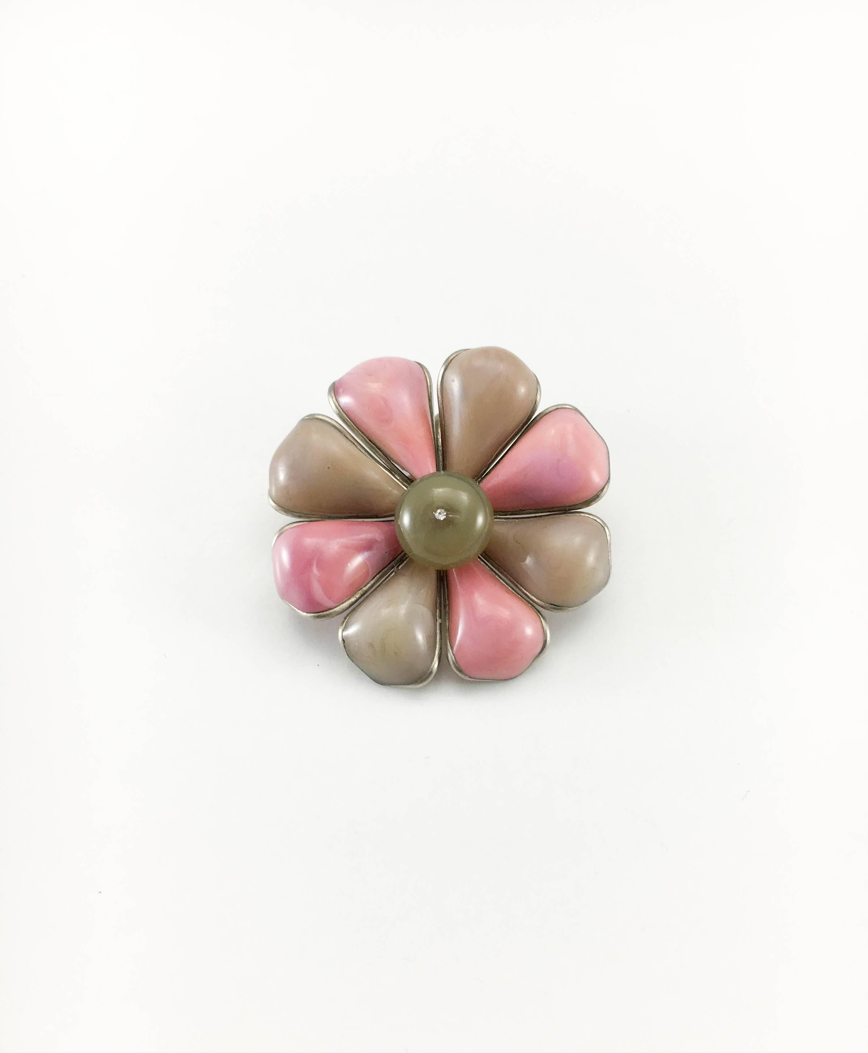 Vintage Chanel Flower Brooch / Pendant. Made in resin, this piece was created for the 1999 Spring / Summer collection. The flower petals are pink and brown, and, in the centre, there is a round brown bead with a rhinestone on top. Versatile, it can
