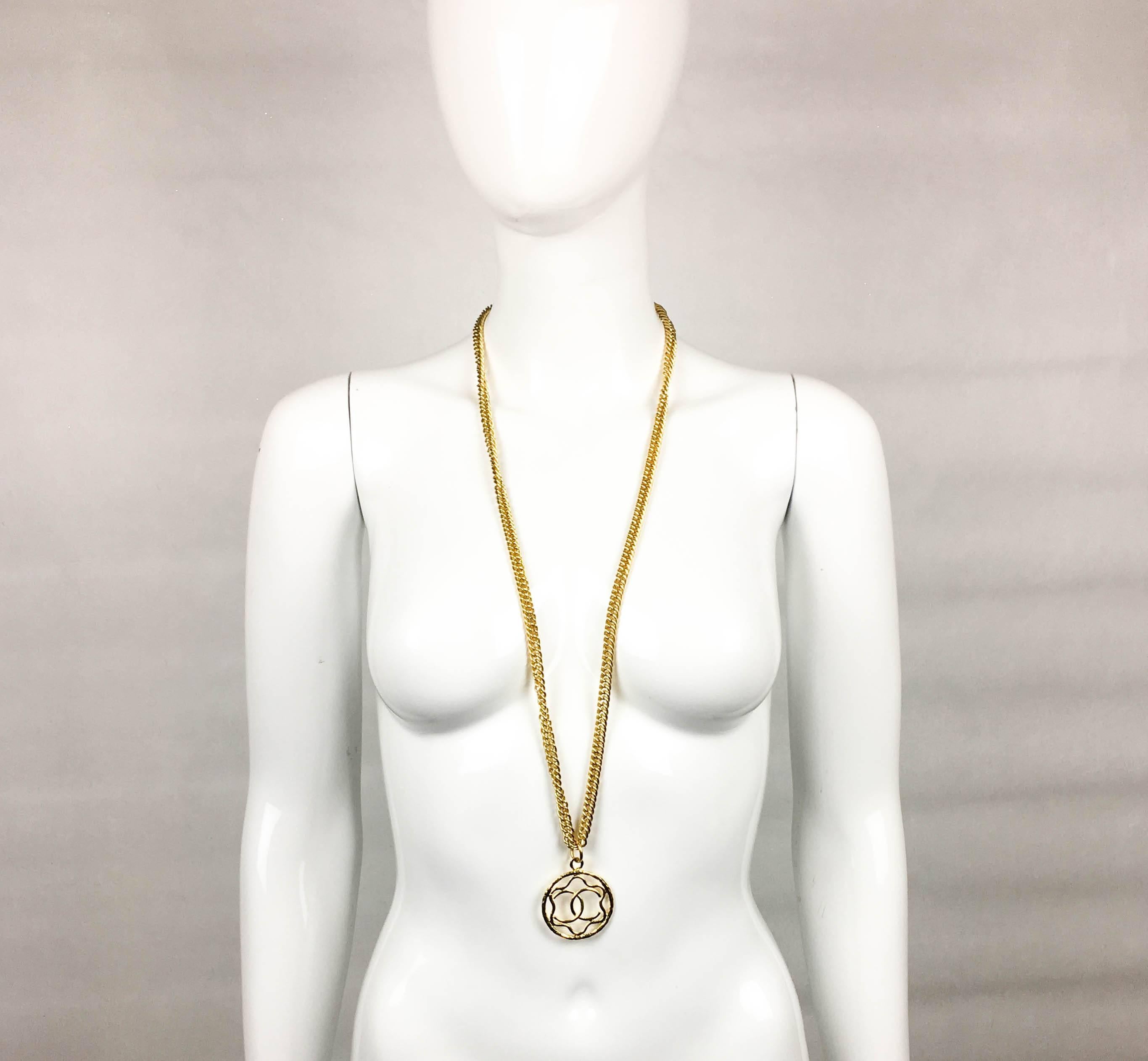 Vintage Chanel Gilt Logo Medallion Pendant Long Chain Necklace. Made in gilt metal, this necklace by Chanel dates from the 1980’s. It comprises of a long gilt chain with a medallion-style ‘CC’ logo pendant. A fashion statement from the iconic House