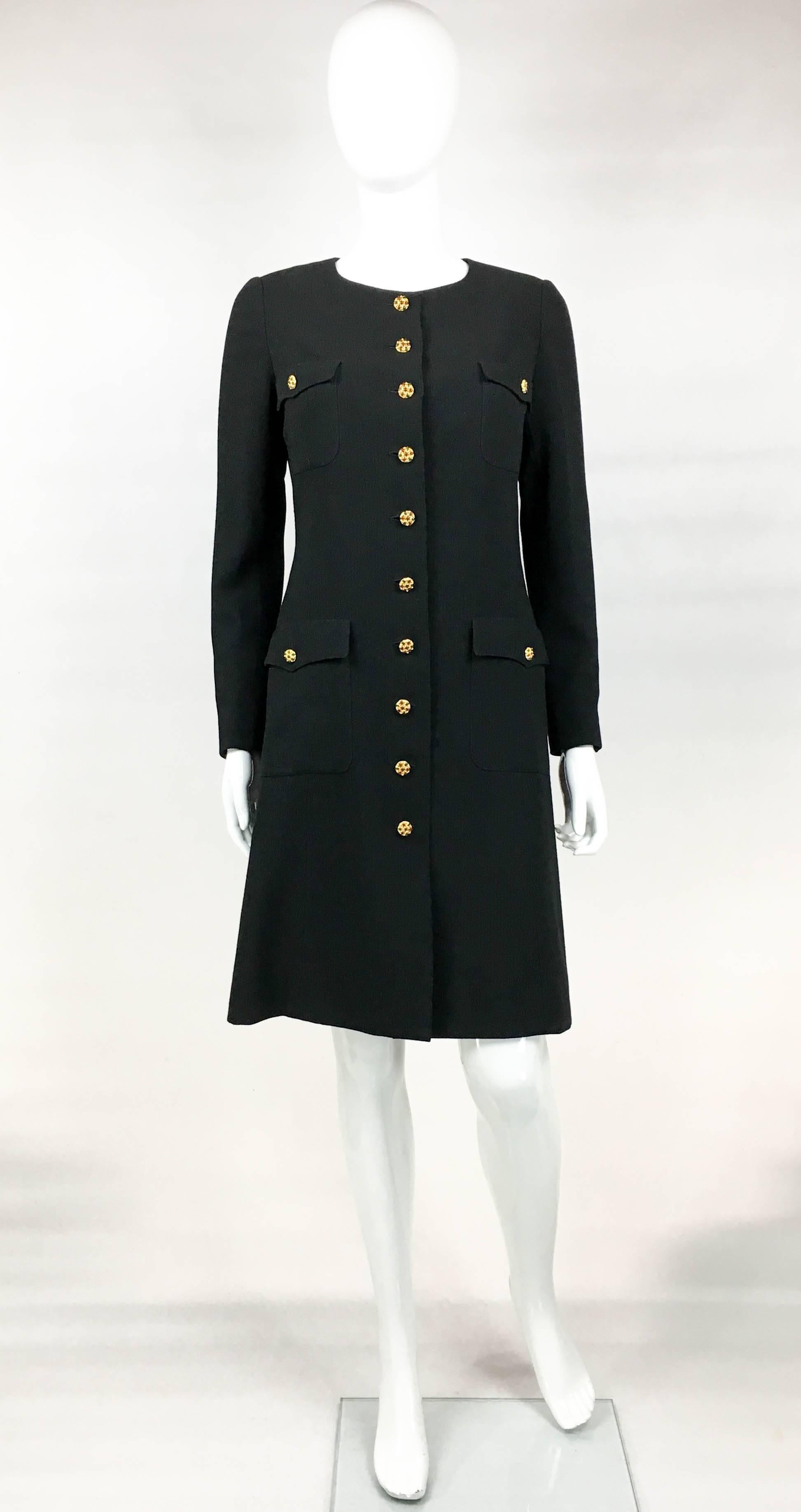 Vintage Chanel Runway Look Black Wool Coat/Dress With Baroque-esque Buttons. This gorgeous piece by Chanel was designed for the 1996 Autumn / Winter Collection and the runway show (refer to photos). Made in light black wool and lined in black silk,