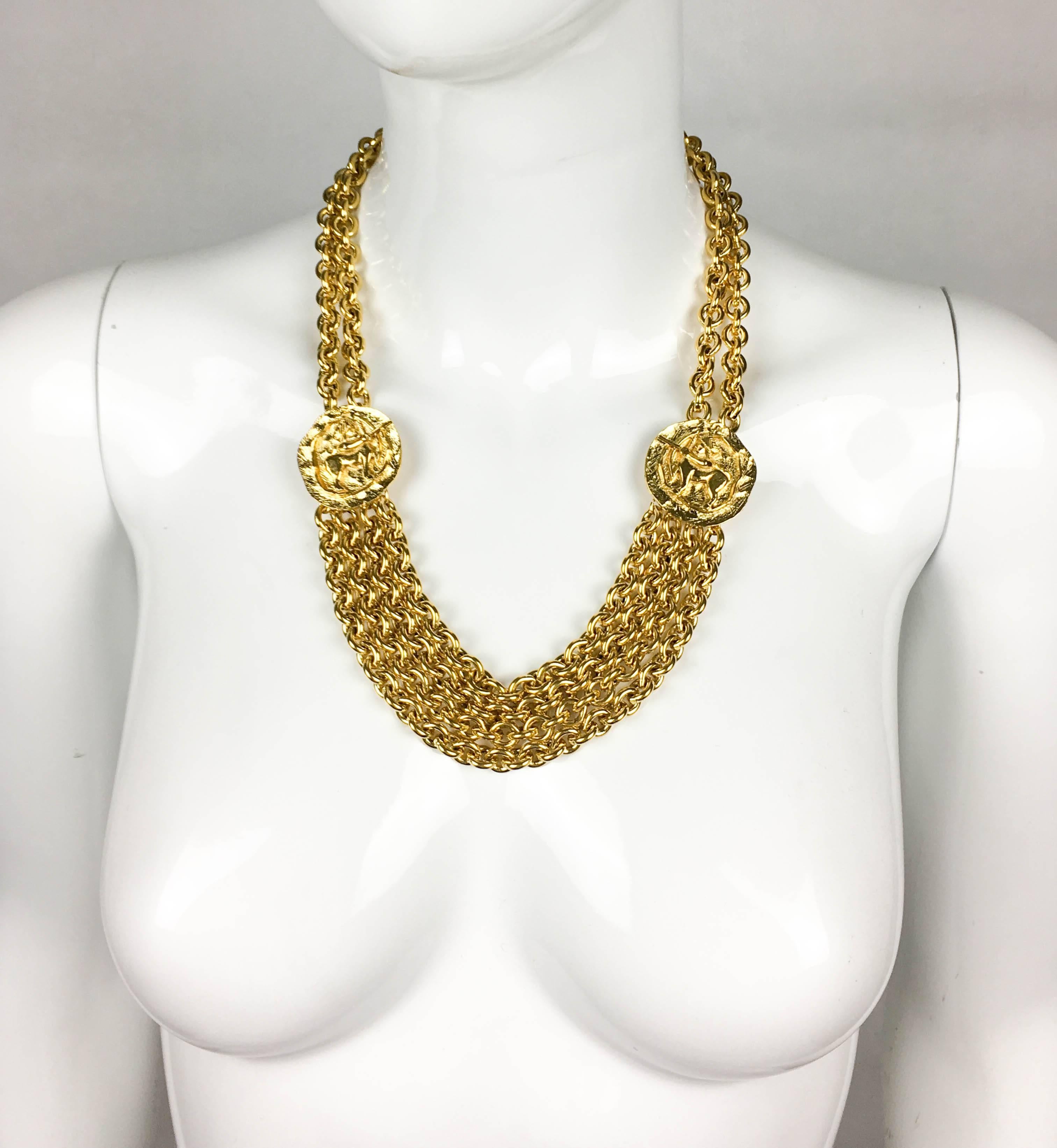 Vintage Chanel Medallion Chain Necklace. This striking necklace was created by Chanel for the 1984 collection. There are 2 gold-plated numbered medallions on each side featuring the image of a centaur, with a gilt double chains going up to the ‘CC’