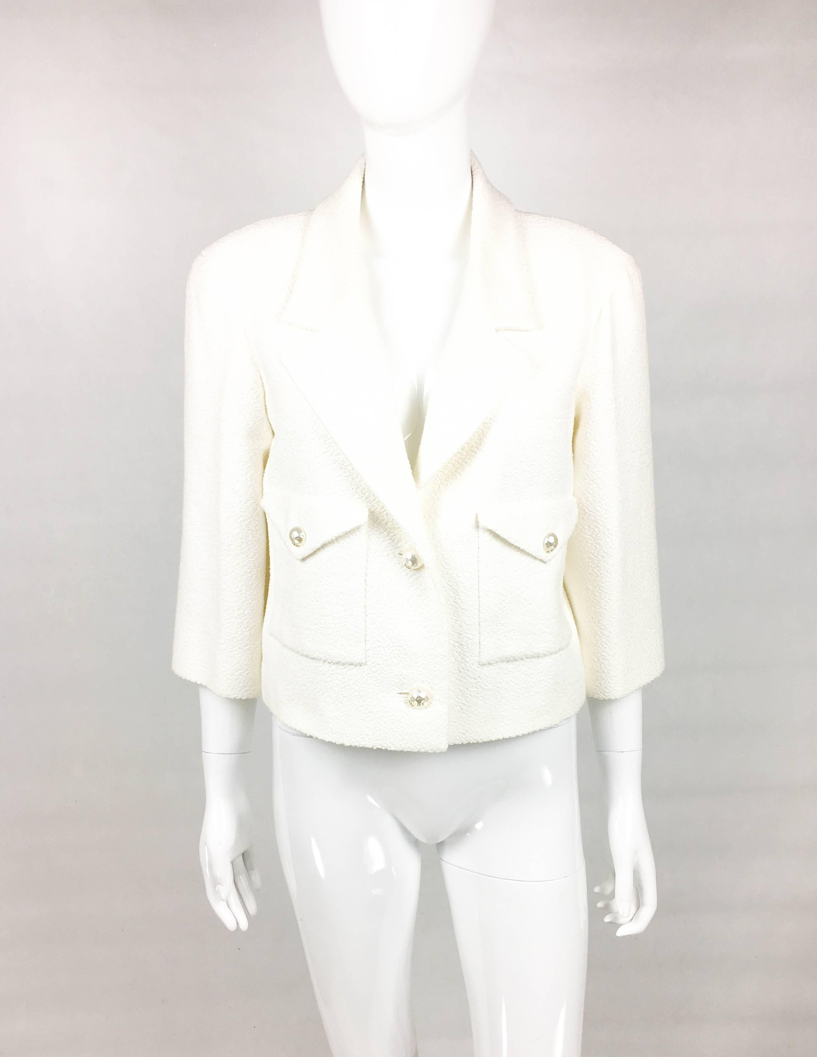 Chanel White Cotton-Blend Jacket With Faux-Pearl Buttons. This beautiful jacket was created for the Chanel 2012 Spring / Summer Collection. An identical design can be seen on a model on the runway show (please refer to photos). Made in a texturized