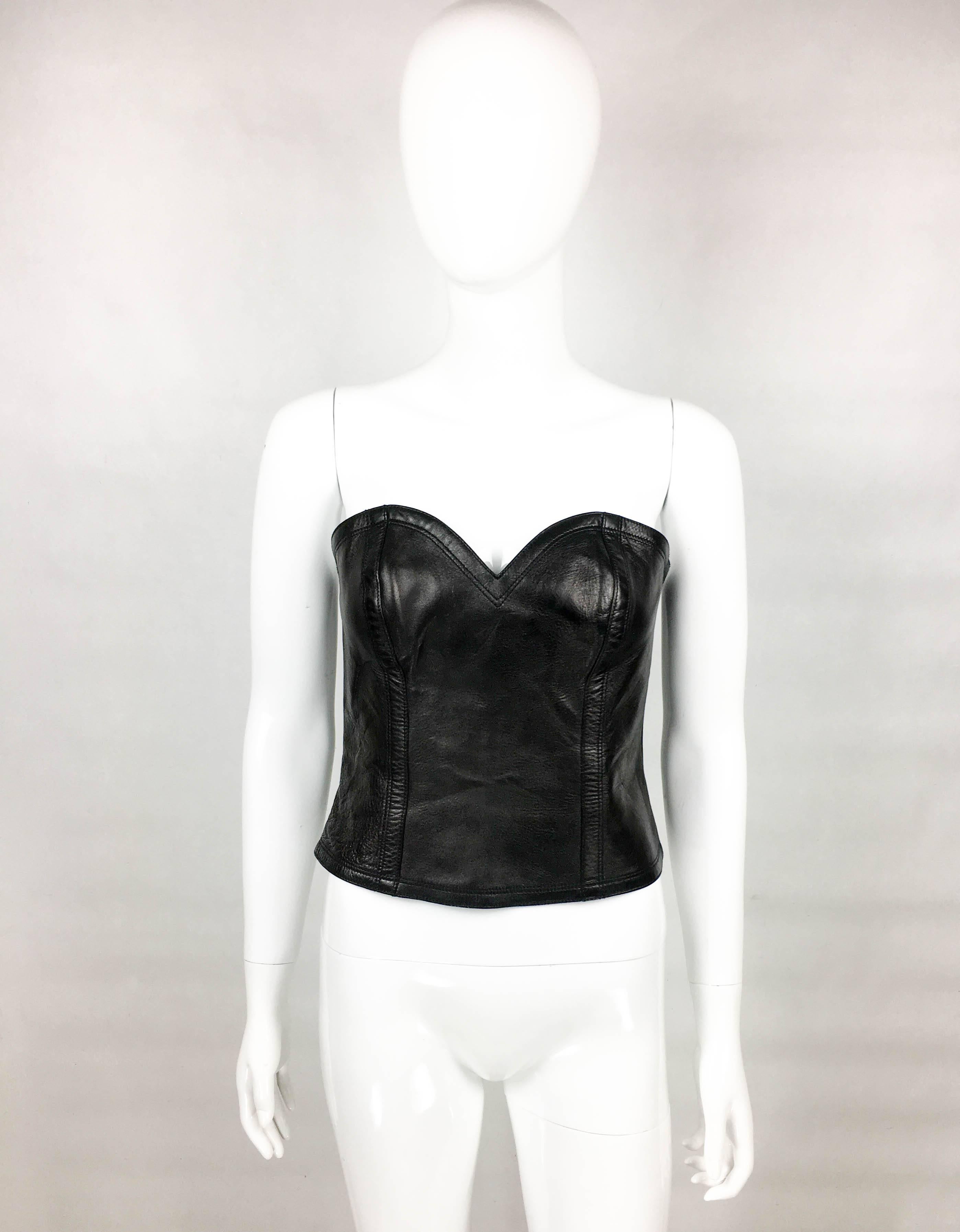 Unworn Yves Saint Laurent Runway Look Black Leather Bustier. This very sexy piece by Yves Saint Laurent was crafted for the 2009 Fall Winter Collection. An identical piece can be seen on the runway show (please refer to photos). It is made in black