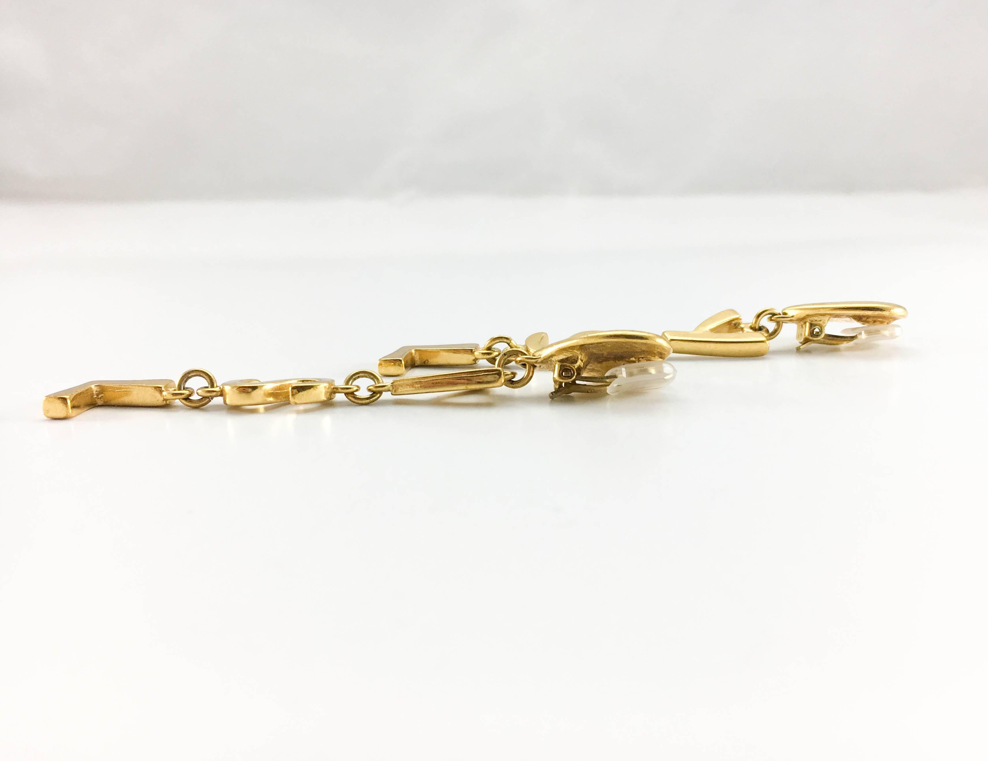 Yves Saint Laurent Long Gold-Plated YSL Dangling Earrings, 1980s  In Excellent Condition In London, Chelsea