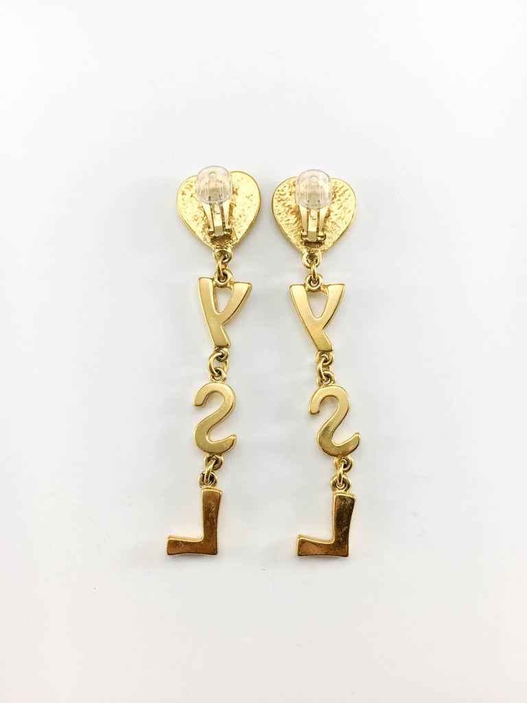 Yves Saint Laurent Long GoldPlated YSL Dangling Earrings, 1980s at