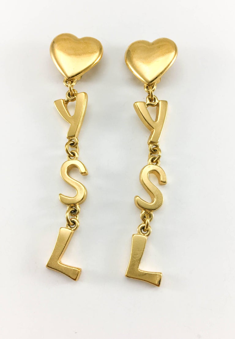 Yves Saint Laurent Long GoldPlated YSL Dangling Earrings, 1980s at