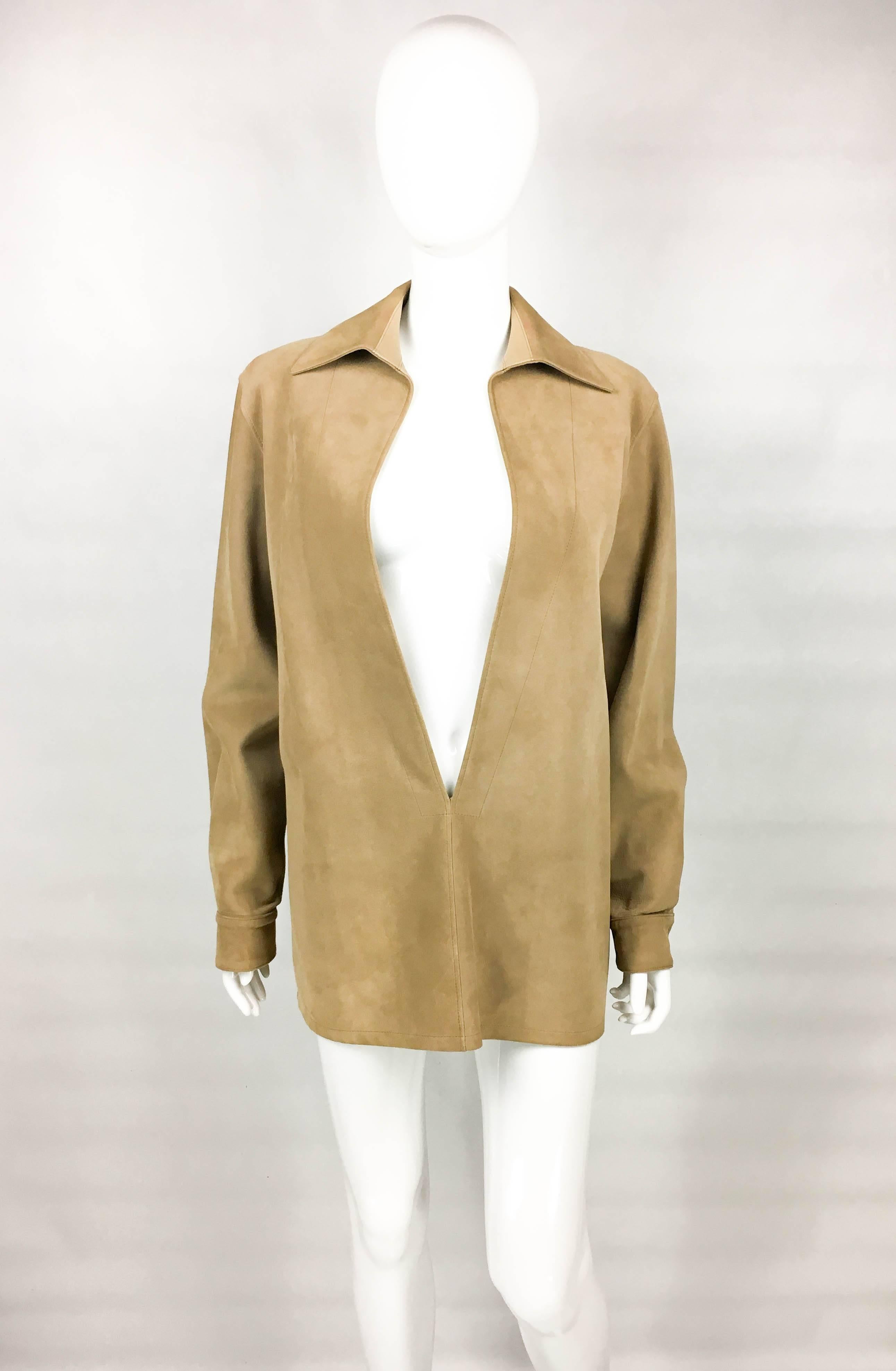 Vintage Hermes Tan Suede Tunic. This ultra-elegant tunic by Hermes was created by the iconic designer Martin Margiela in 1998. Margiela reworked the classic Hermes’ trademarks during his reign, and was widely responsible for the resurgence of the