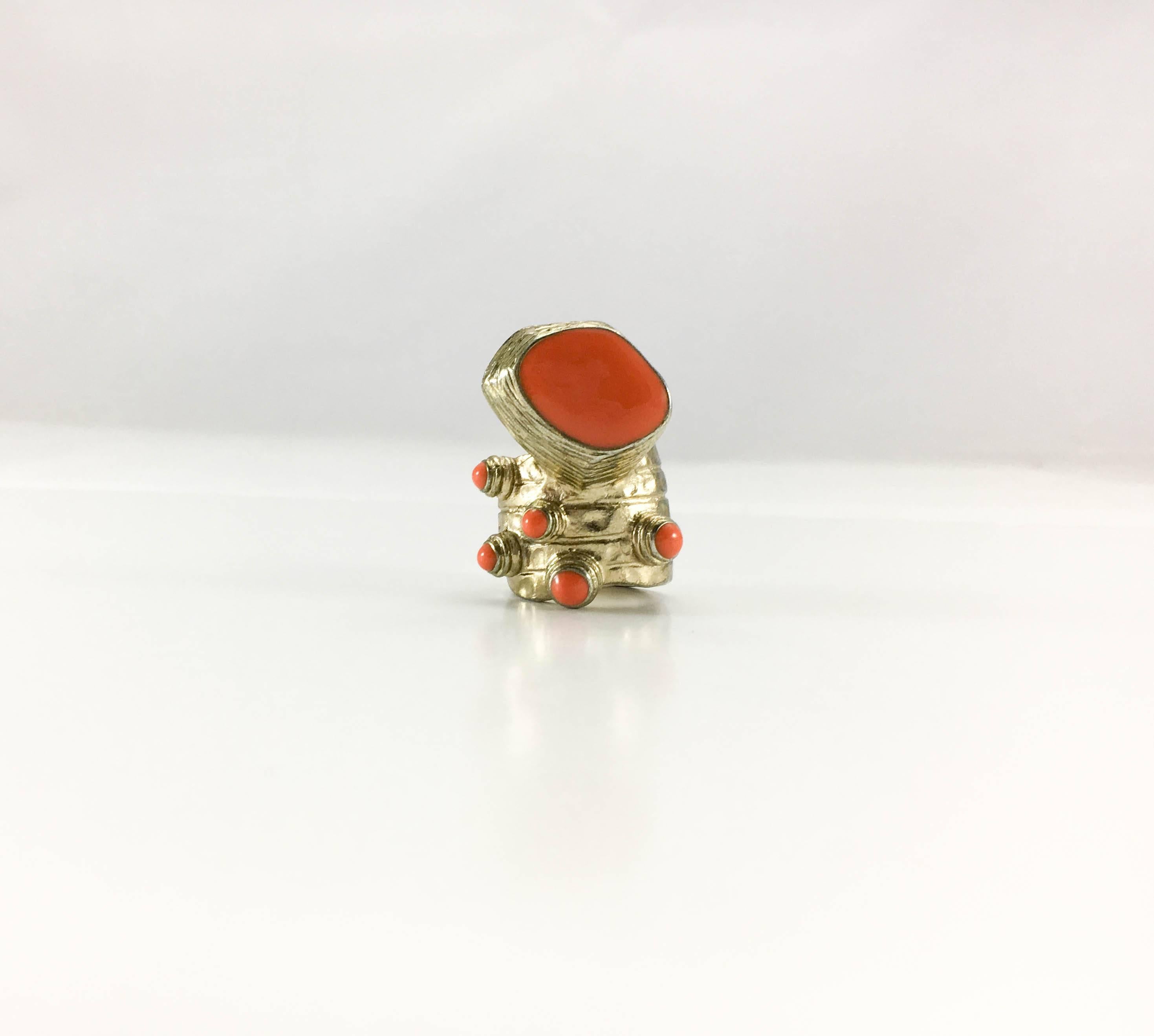 Vintage Yves Saint Laurent Chunky Modernist Ring. This striking ring by Yves Saint Laurent was created in the 1990’s. Of modernist design, it is made in gilt (light gilding) metal and features faux coral beads. Yves Saint Laurent signed. A bit of