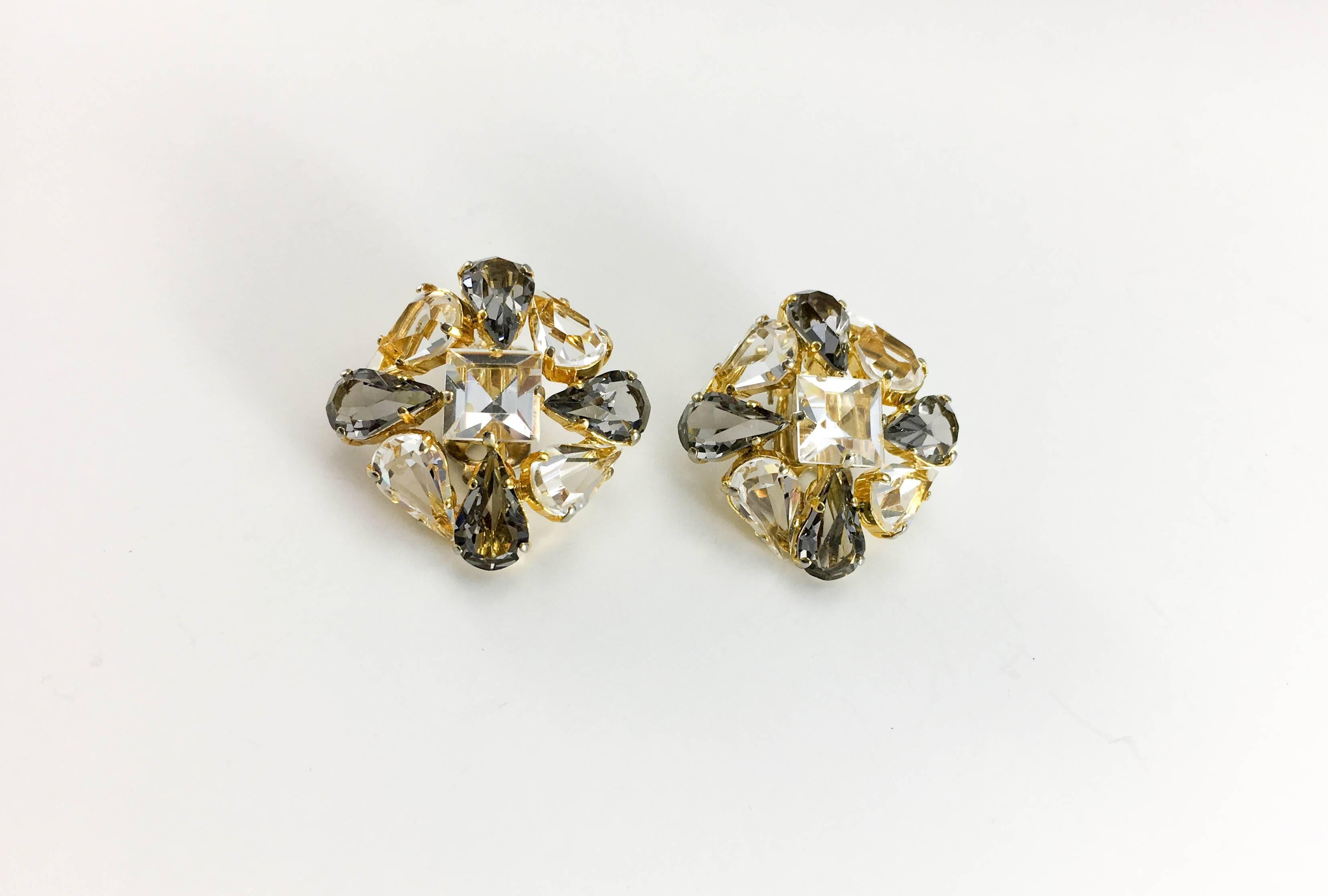 Vintage Christian Dior Crystal Clip-on Earrings. These stunning earrings by Dior date back from 1962. Made in gilt metal, the backless setting allow light through the crystals making them very sparkly. There are 2 different shapes of crystal (or