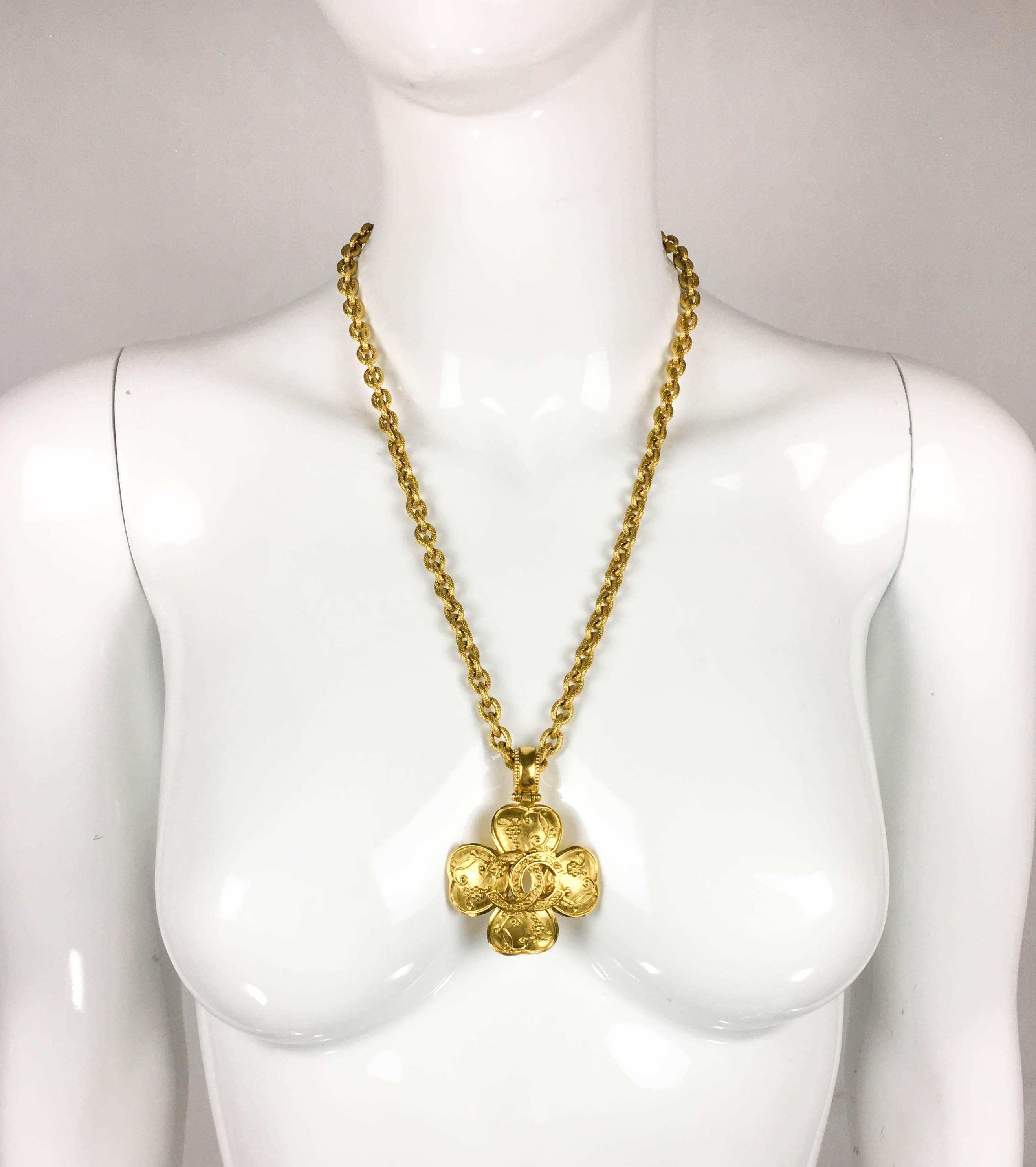 Vintage Chanel Clover Pendant Necklace. This beautiful piece by Chanel was created for the 1996 Autumn / Winter Collection. Gold-plated, it consists of a chain and pendant. The clover-shaped pendant bears the iconic ‘CC’ logo in the centre and