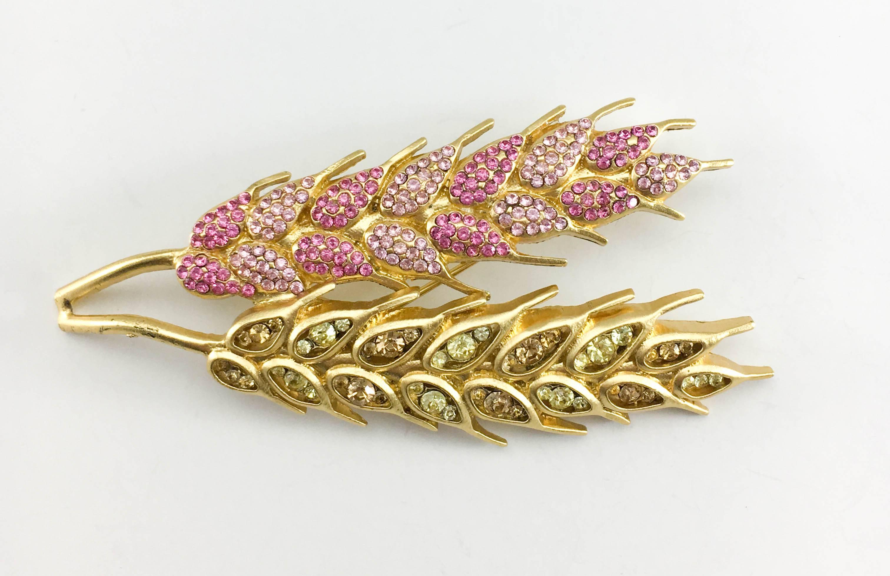 Vintage Chanel Wheat Sheaf Brooch. This beautiful brooch by Chanel was crafted for the 2003 Cruise Collection. Lagerfeld brought a whimsical touch with candy colours appearing throughout the collection. Gold-Plated, this pin brooch is shaped as a