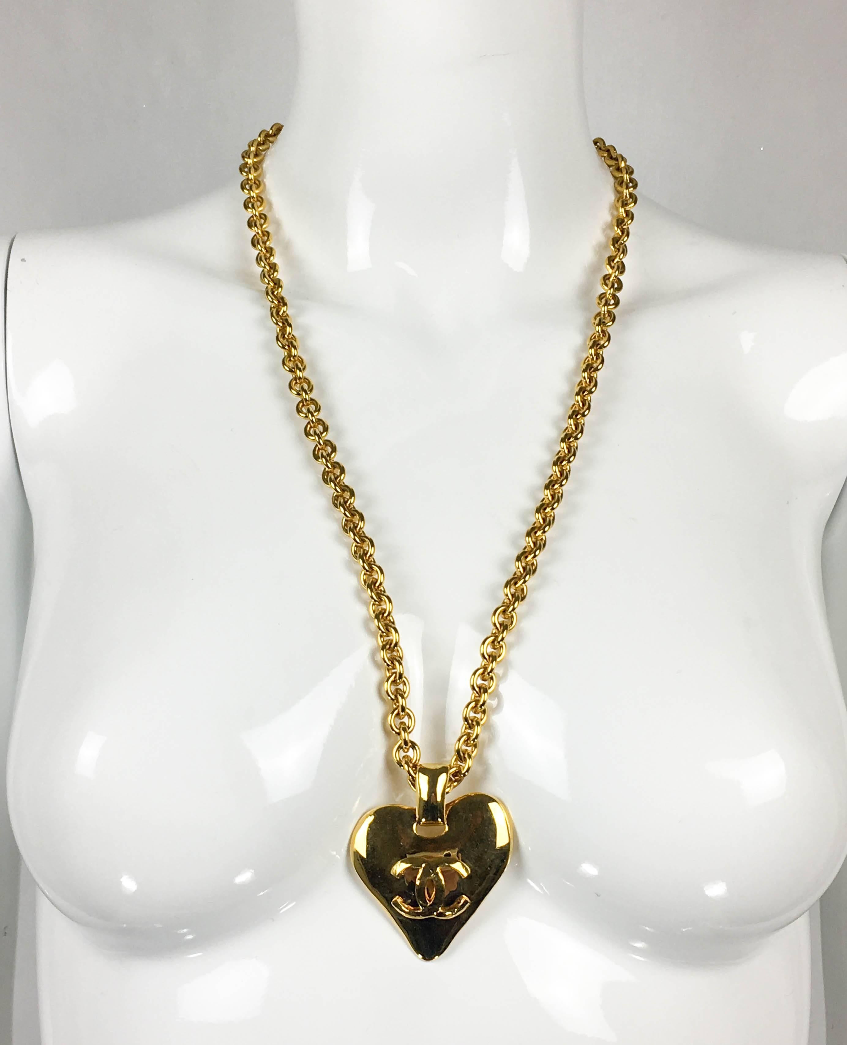 Vintage Chanel Heart-Shaped Pendant Necklace. This striking pendant necklace by Chanel was designed for the 1993 Spring / Summer Collection. Gold-Plated, it comprises of a chain and a heart-shaped pendant with the iconic ‘CC’ logo in the middle.