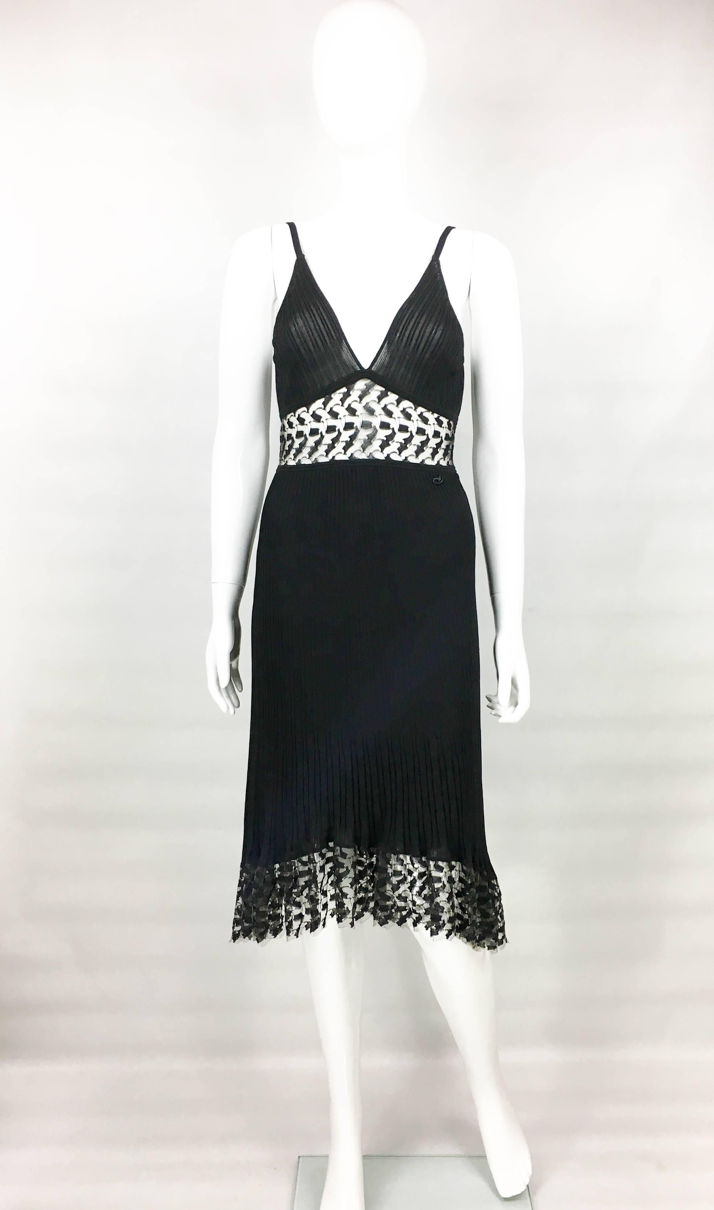 Chanel Black and Lace Ribbed Dress. This chic dress by Chanel is created for the 2006 Cruise Collection. In the collection, presented at the Grand Central in New York City, Karl Lagerfeld’s designs were feminine with an edge. The dress is ribbed and