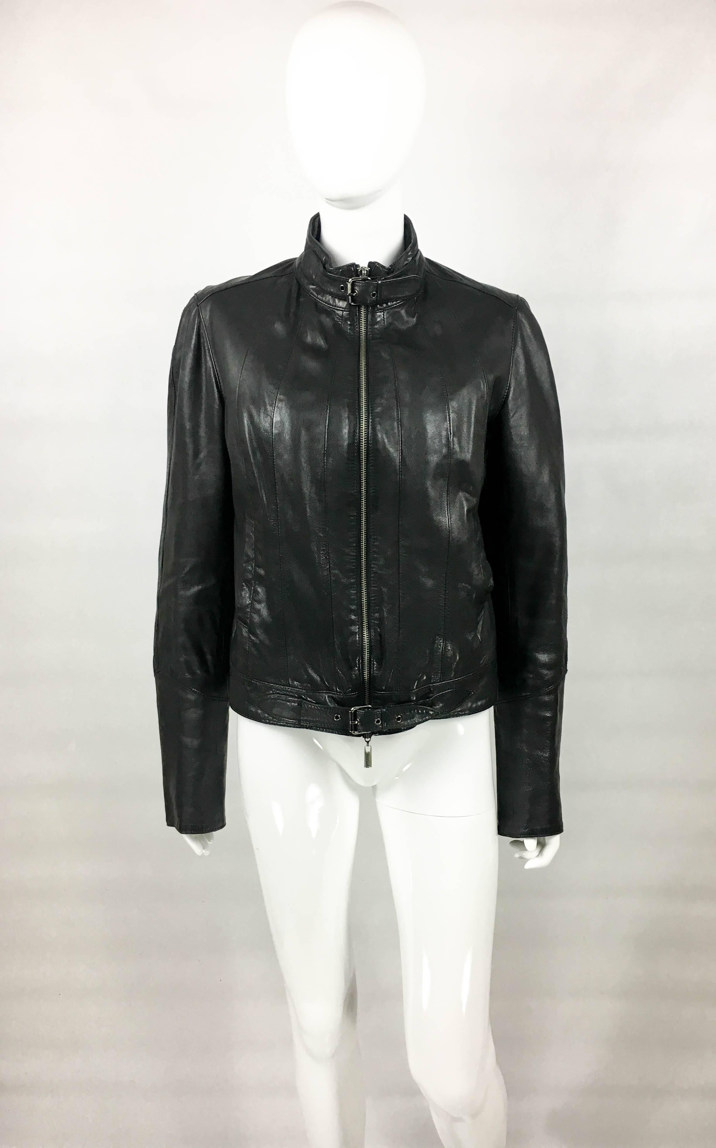 Jean Paul Gaultier Black Leather Biker Jacket With Quilted Lining. This stylish jacket by Jean Paul Gaultier is made in black leather and is constructed with panels, which creates interesting patterns. Closure is by an open-end two-way zipper,