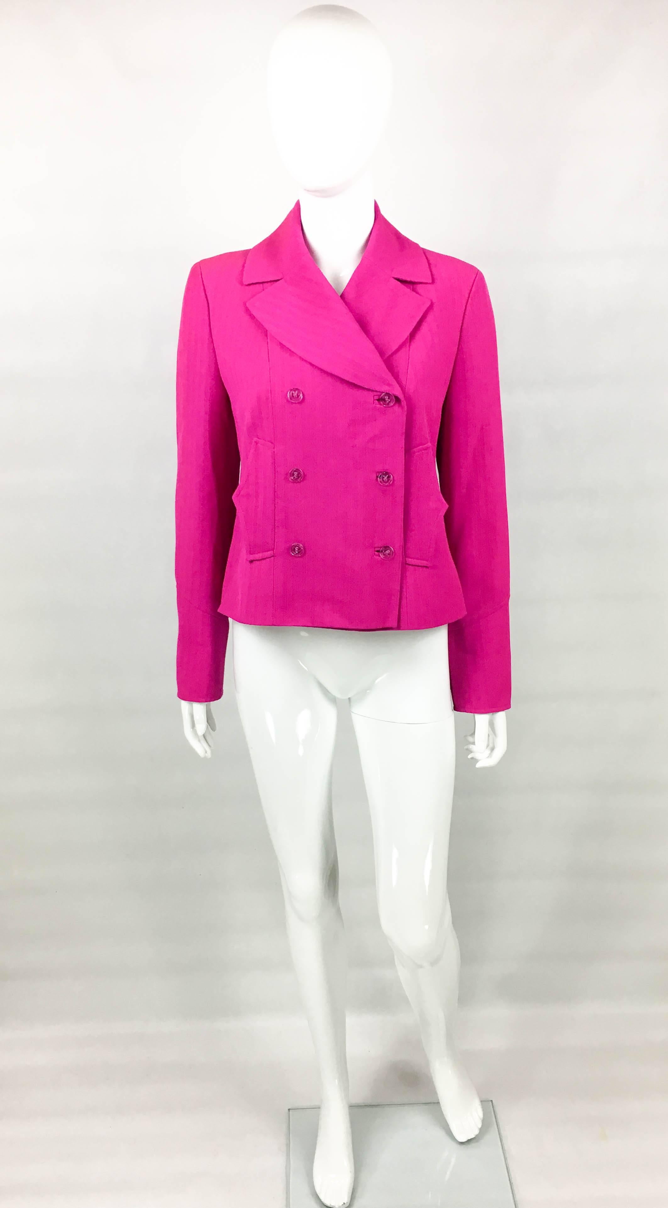 Vintage Lacroix Fuchsia Jacket. This striking jacket by Christian Lacroix dates back from the 1990’s. Made in shocking pink wool, it is packed with the glamour and attitude that is peculiar to Lacroix creations. The transparent acrylic buttons