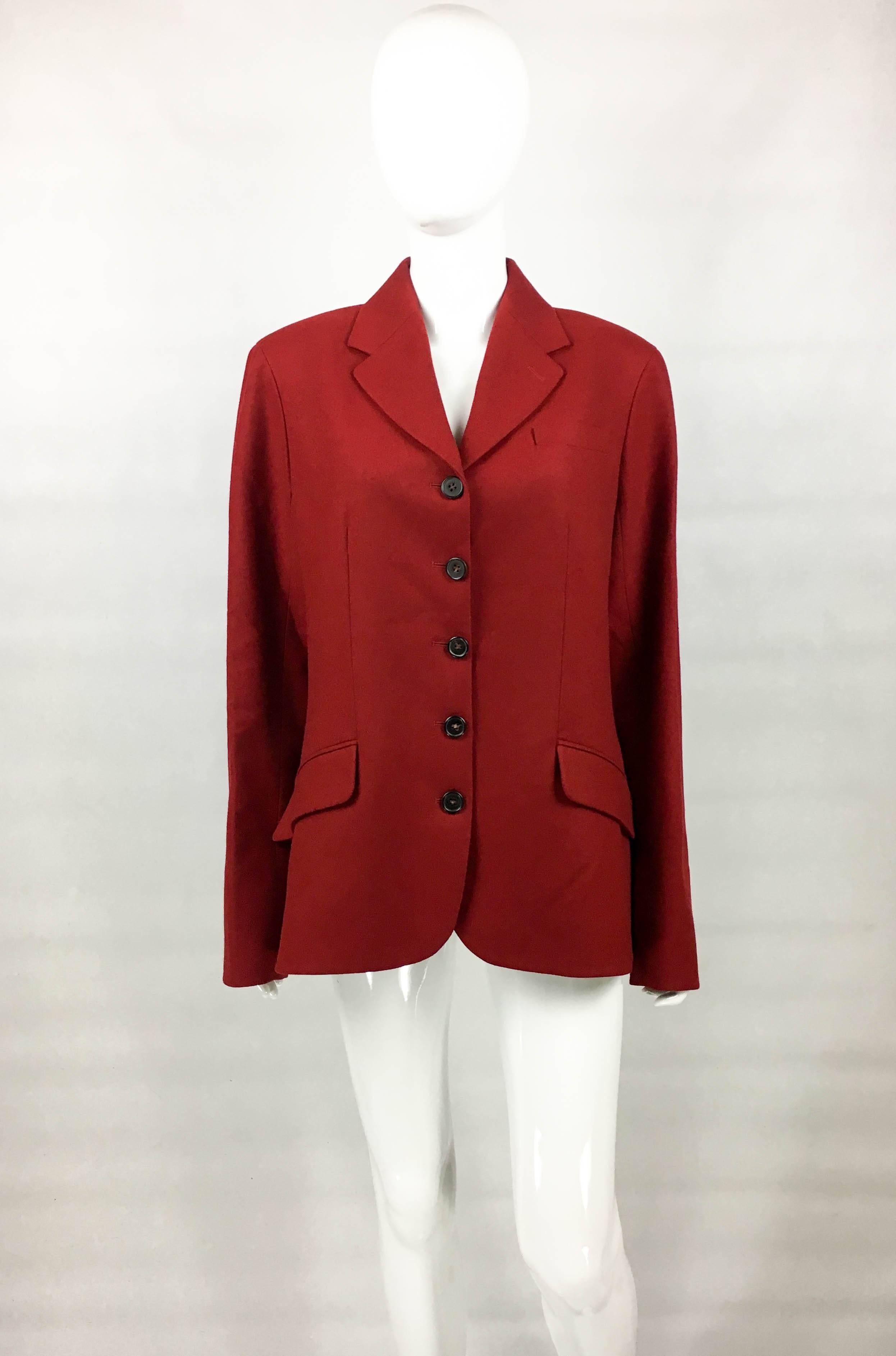 Vintage Hermes Red Wool Jacket. This beautiful jacket by Hermes dates back from the 1990’s. Crafted in deep red virgin wool, it has 5 buttons down the front and 3 on each cuff. There are 2 front pockets. Lined. A gorgeous piece bringing the