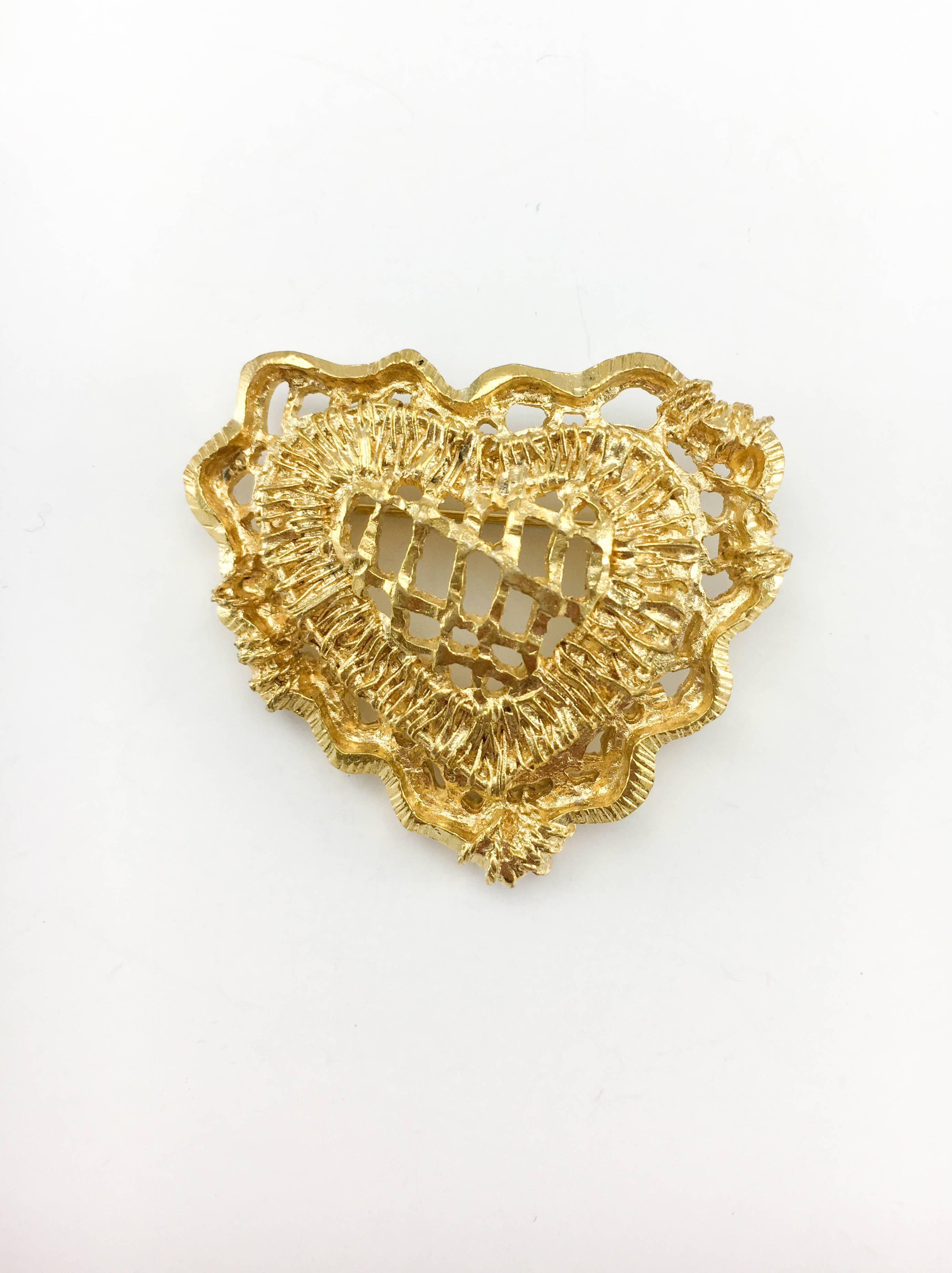 Vintage Christian Lacroix Gold-Plated Stylised Heart Brooch. This beautiful piece by Lacroix dates back from the 1990’s. Crafted in gold-plated metal, it features a cut-out design of a stylised heart. Christian Lacroix signed on the back. A gorgeous