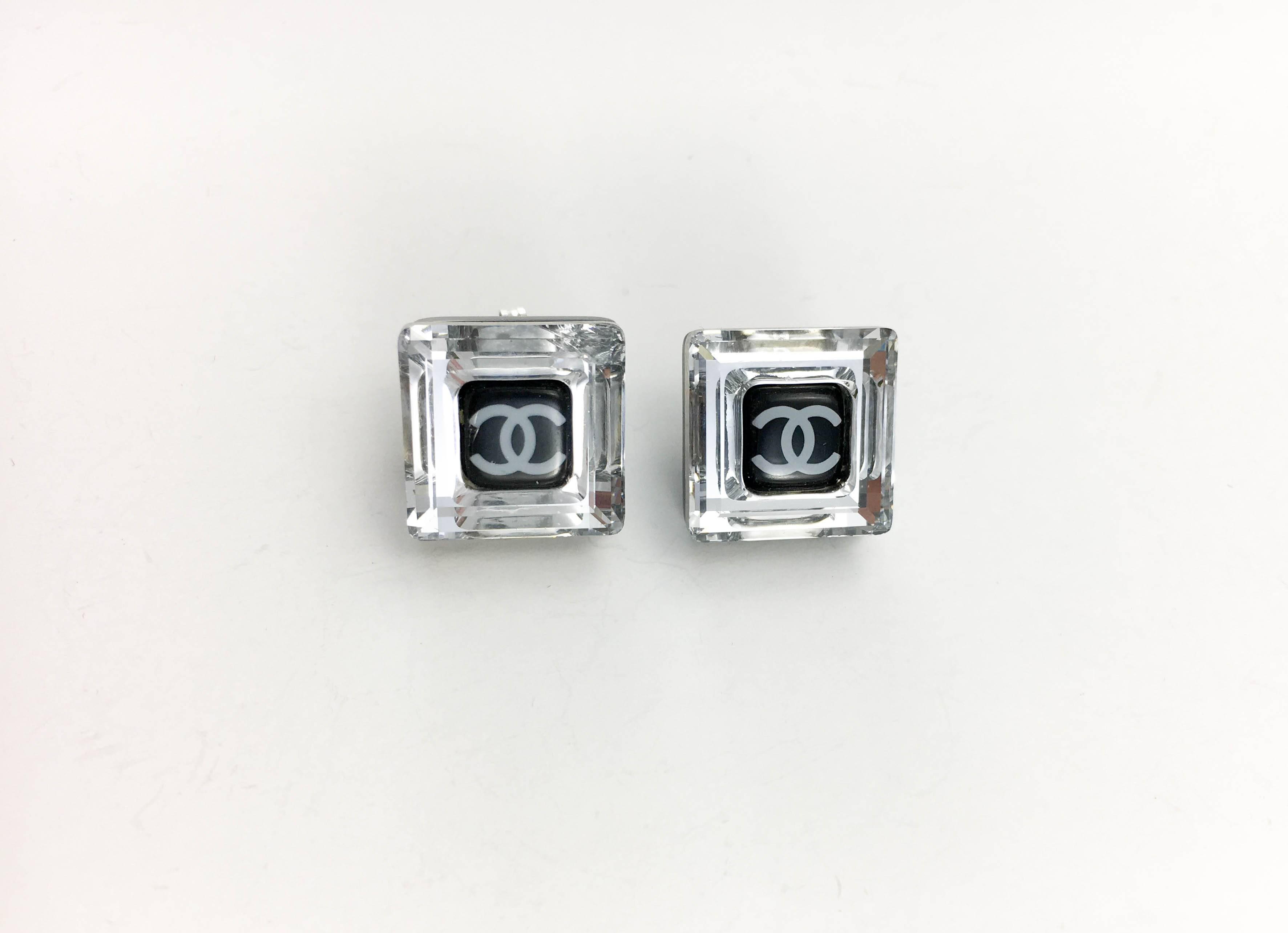 Chanel Square Logo Post Earrings. These beautiful earrings by Chanel were created for the 2005 Autumn / Winter Collection. Made in clear and black resin, these delicate square-shaped earrings feature the iconic ‘CC’ logo in the centre. Chanel marked