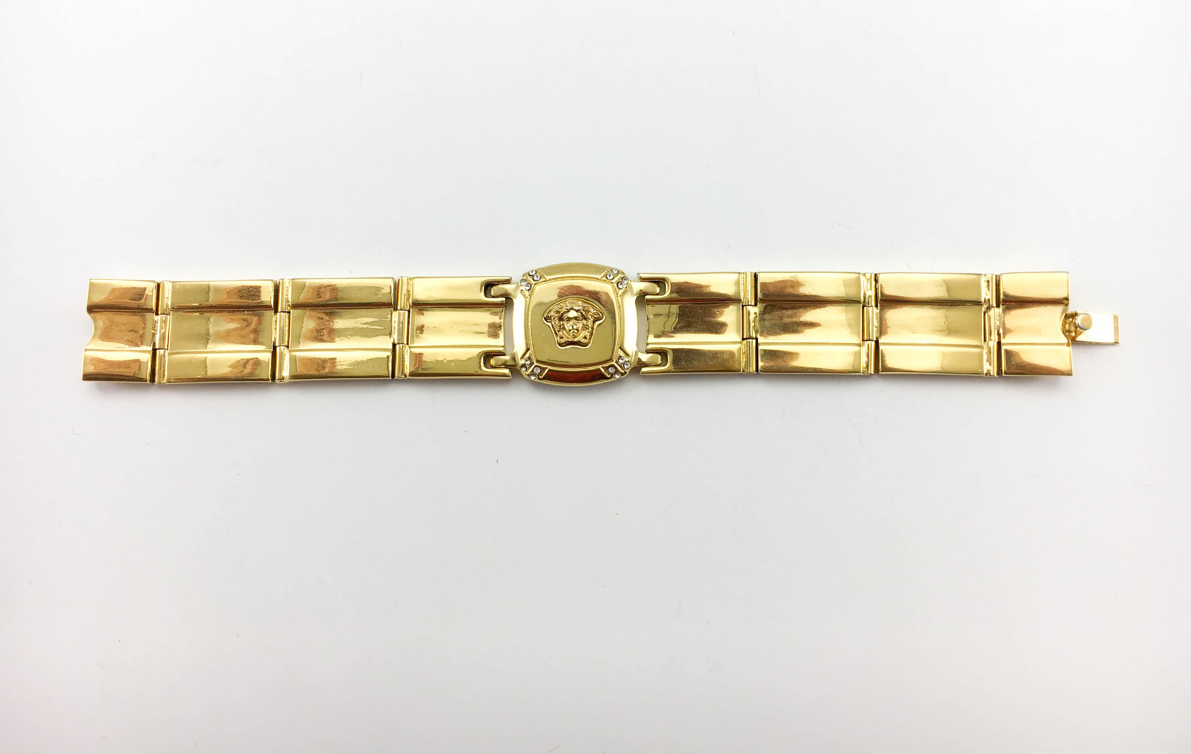 Vintage Gianni Versace Gold-Plated Medusa Head Bracelet. This gorgeous piece by Versace dates back from the 1990’s, when Gianni Versace himself was still alive. Crafted in gold-plated metal, it features a square link in the centre bearing the iconic