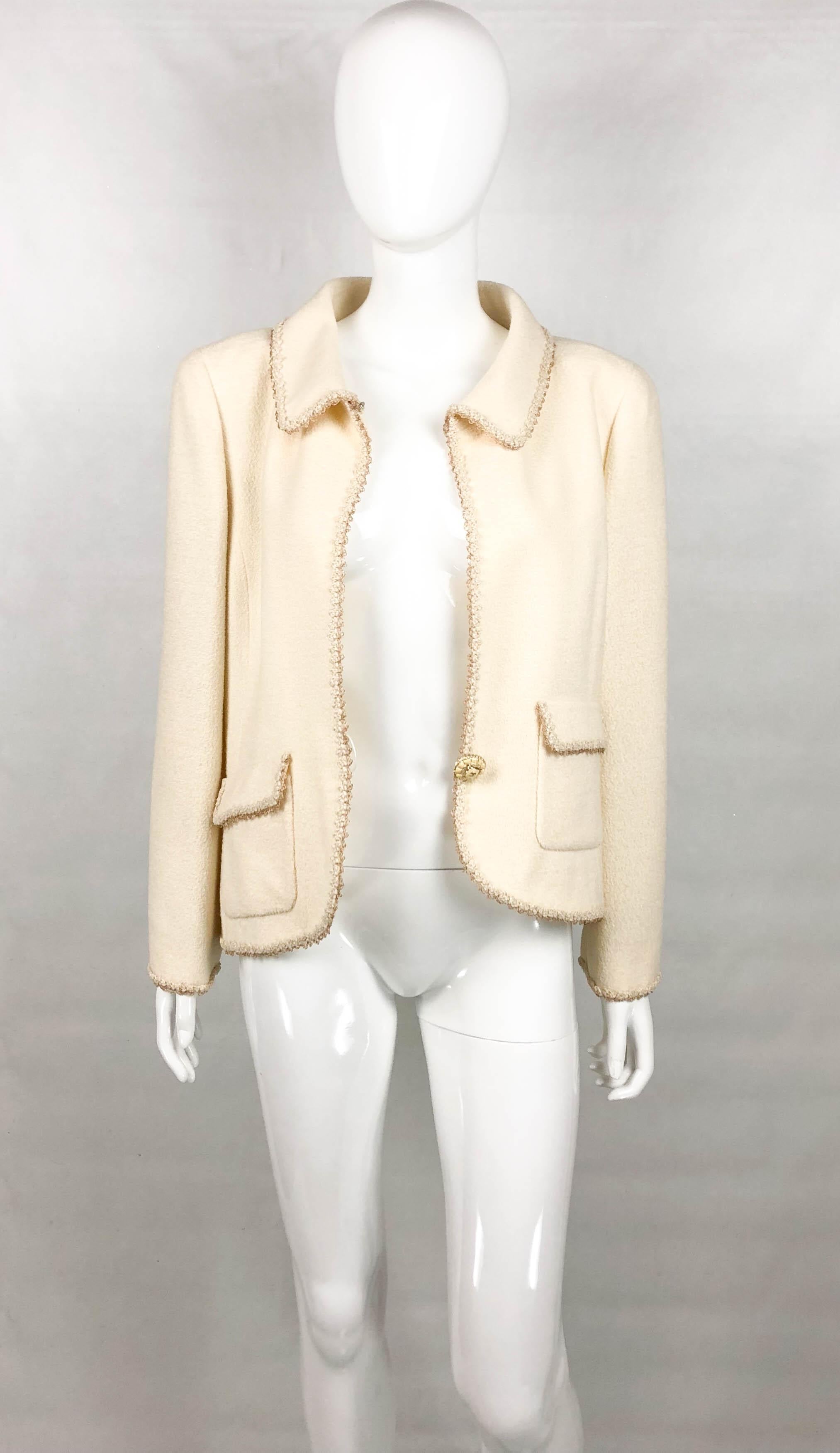 Chanel Runway Look Cream Wool Blend Jacket. This beautiful cream jacket by Chanel was created for the 2010 Cruise Collection. A model can be seen wearing an identical piece on the runway (please refer to photos). The jacket features gold thread