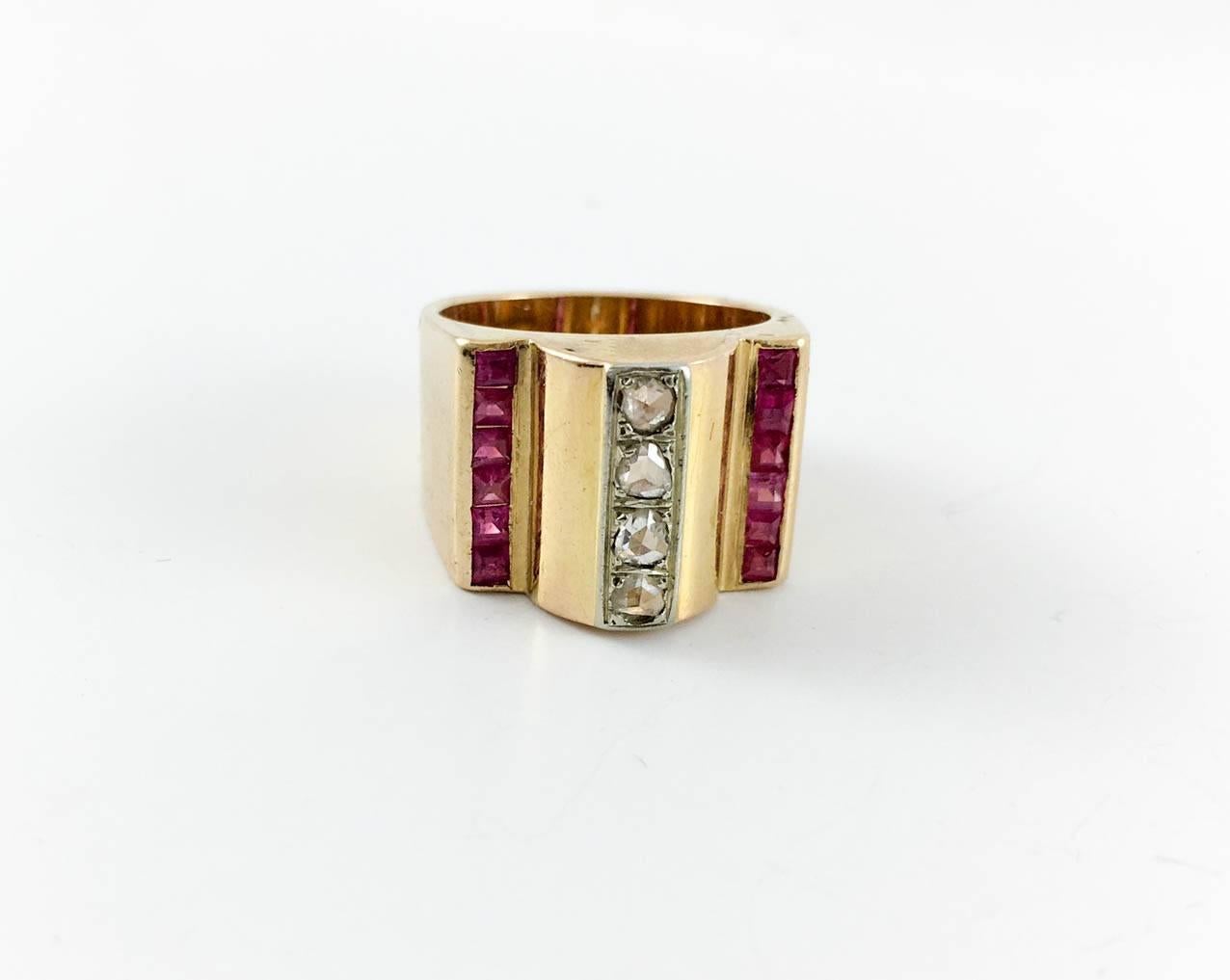 Stylish Vintage Cocktail Ring. This ring has a strong design with old cut diamonds and synthetic rubies. It is a large ring in typical 1940s style. It will certainly bring a bit of old glamour to any look. Hallmarked.
Period: 1940s

Origin: