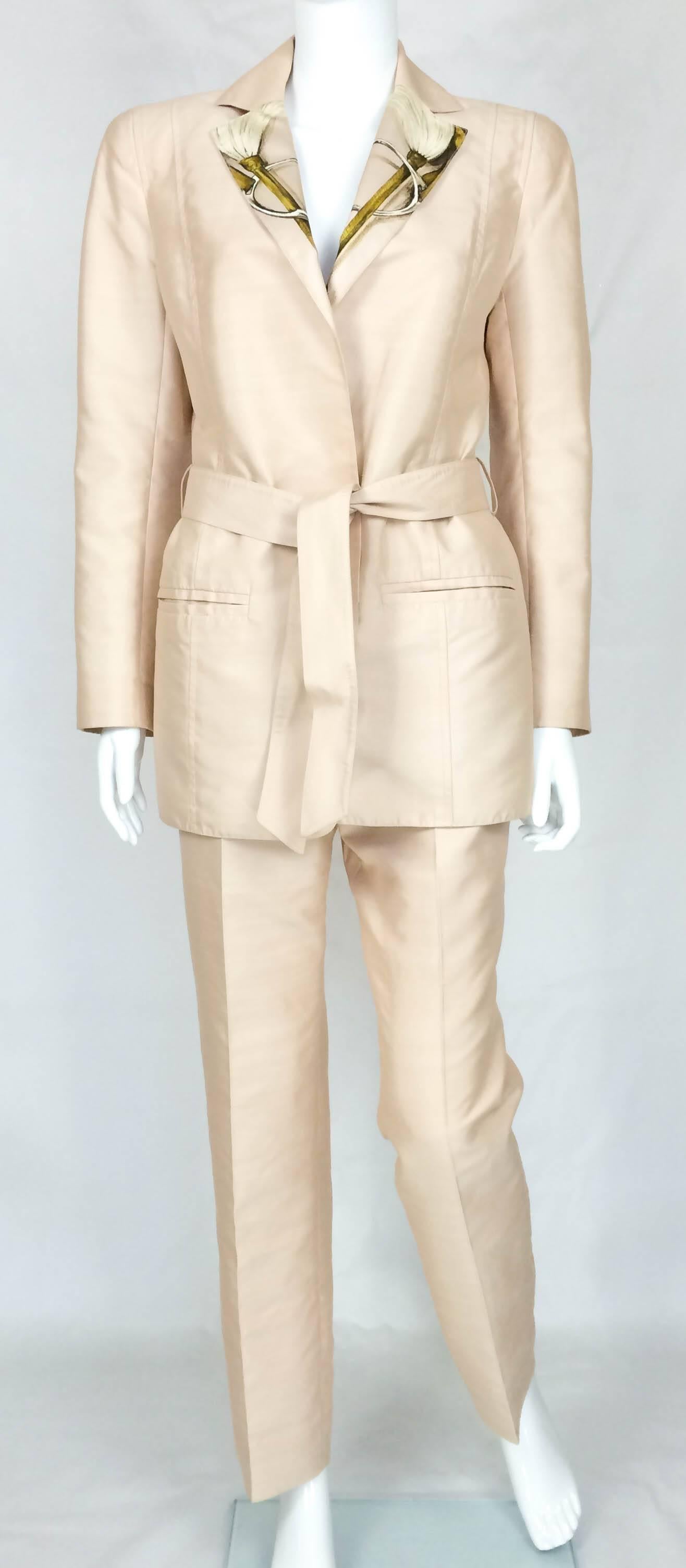 Ultra-Chic Vintage Hermes Silk Blend Suit. Ravishing 2-piece jacket and trousers set in dusty pink. The jacket has 2 front pockets, jacket belt and belt loops, notched lapels and lining featuring the iconic equestrian scarf print A Propos de Bottes