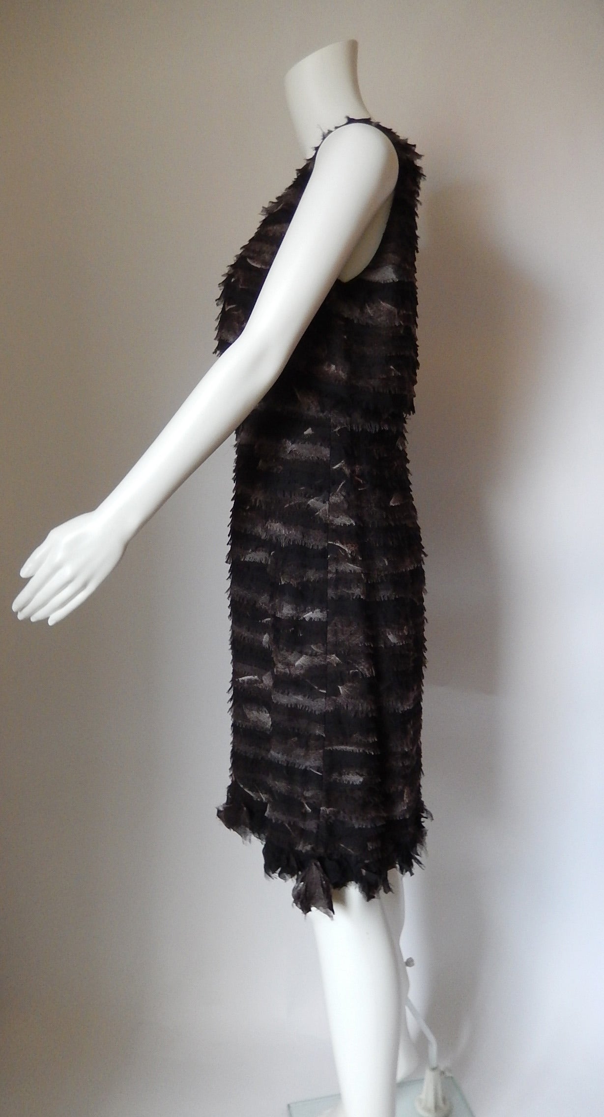 Never worn Chado Ralph Rucci Haute Couture Exquisite Dress
$9,600 at retail
Black/Brown/Grey tiered dress with fringed edges 
Bottom is all pieced ruffles sewn to the bottom of the dress
Sleeveless capelet style bodice top which snaps down in