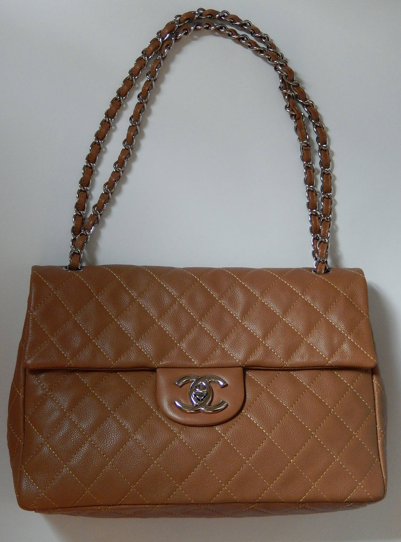 Chanel single Flap Soft Caviar Leather Maxi Flap Bag
Measures 13' b 9