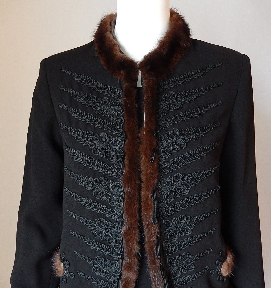 Jean Paul Gaultier Black Jacket
Embroidery stitching with black loops which gradually enlarge as they cascade down the brown mink front panels
Mink fur on collar, fake front pockets, cuffs and bottom of jacket
Large woven material button closures