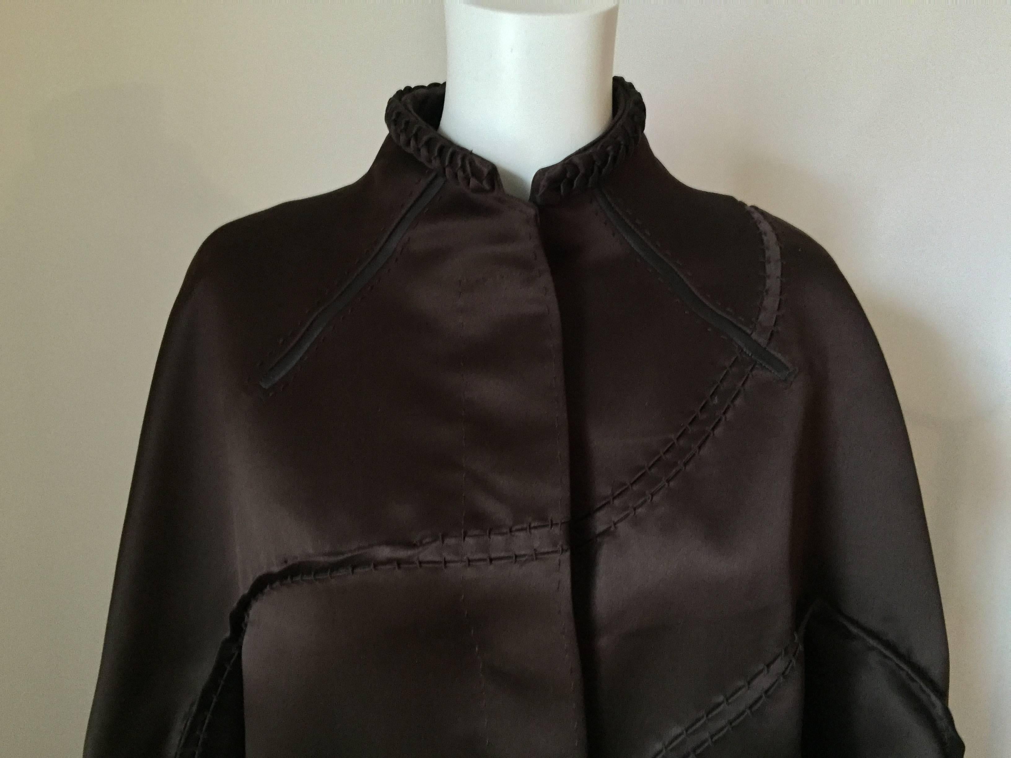 
Mint, pristine Chado Ralph Rucci Coat.

An incredible piece with so many painstaking details that you are sure to get many, many compliments on this one.

It is 100% Silk and at the top, cuffs and hem, are braided silk pieces. Moving down the